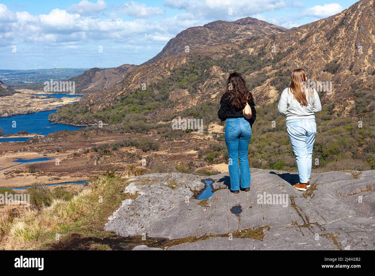 Good Friday, 15th April 2022. Killarney, Co. Kerry. Two American visitors, enjoying the scenery, warm weather and bright sunshine at Ladies View in the Killarney National Park, County Kerry, Ireland. Image Credit: Stephen Power / Alamy Live News. Stock Photo