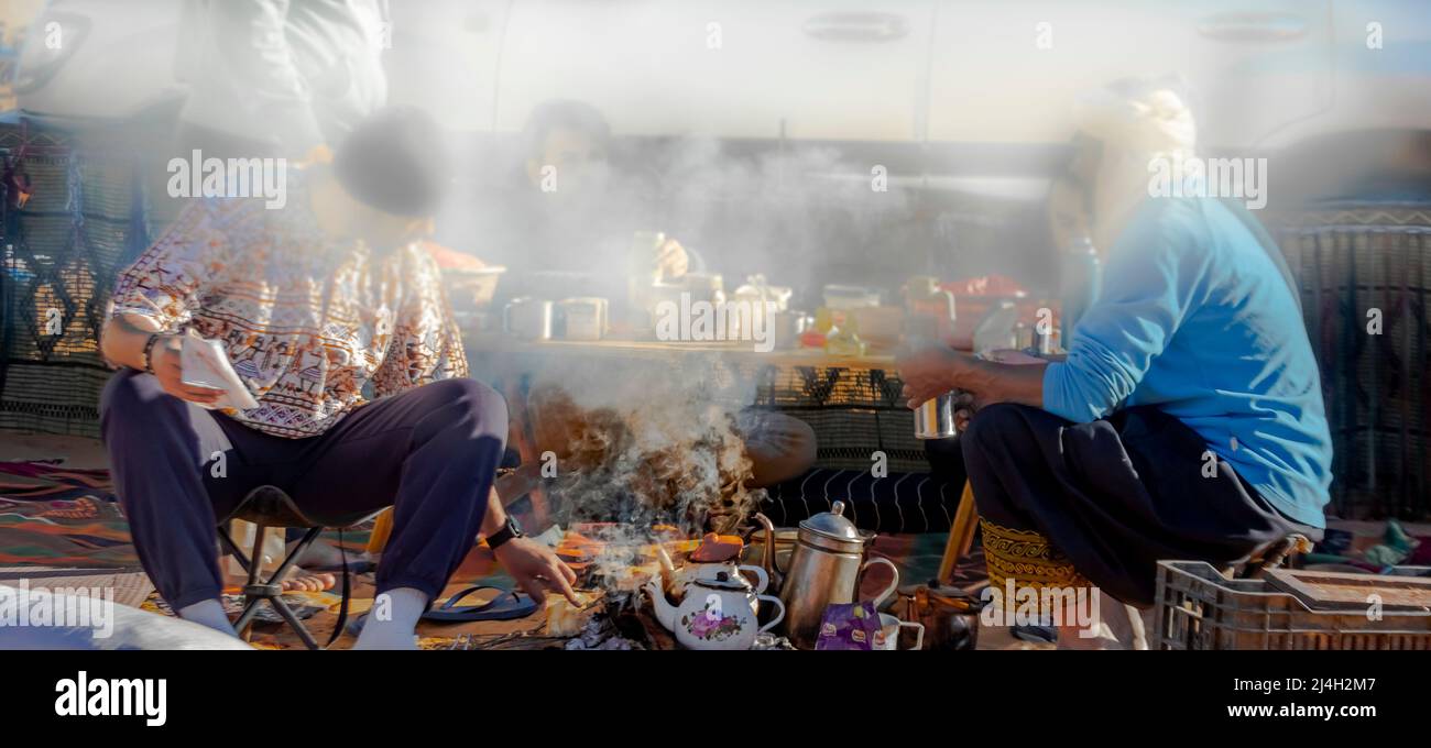 Morning coffee around a fire pit Stock Photo - Alamy