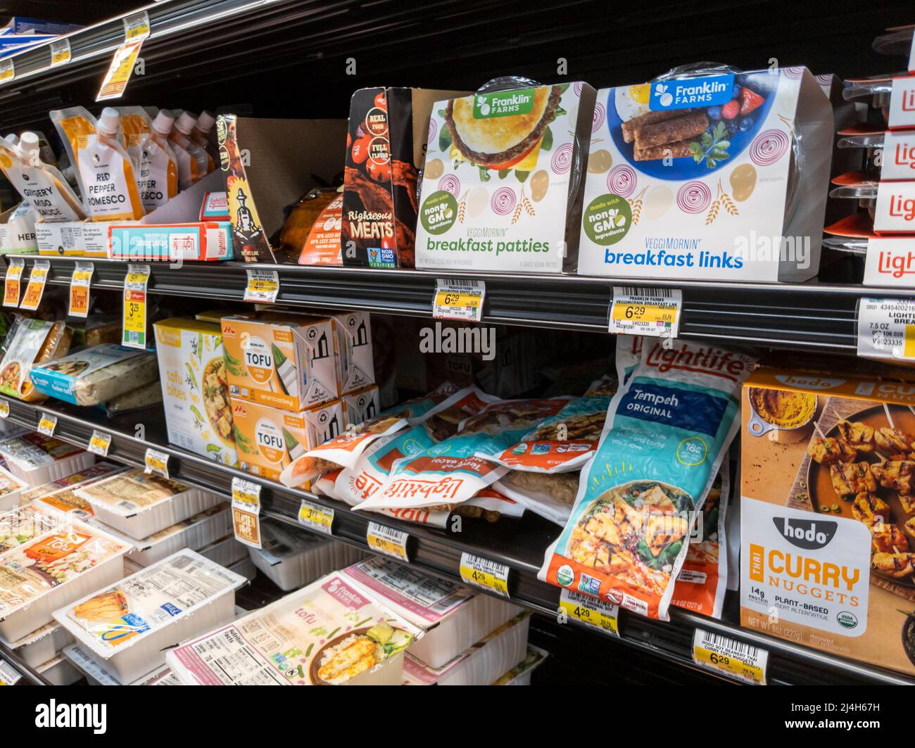 Woodinville, WA USA - circa April 2022: Angled view of meatless and meat alternative products in the refrigerated section of a Haggen grocery store Stock Photo