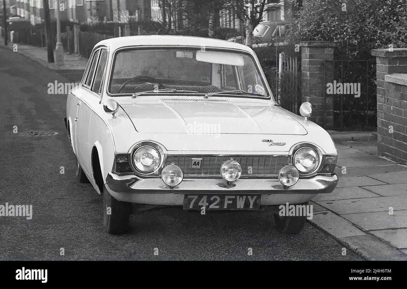 1969, historical, front view of a Ford Corsair car parked in a suburban street, England, UK. Known originally as the Ford Consul Corsair, but commonly referred to as the Ford Corsair, the car was produced in Britain between 1963 and 1970. The right handed two door model seen here was comparatively rare, as most of the 2-door saloons were LHD, made for export. Stock Photo
