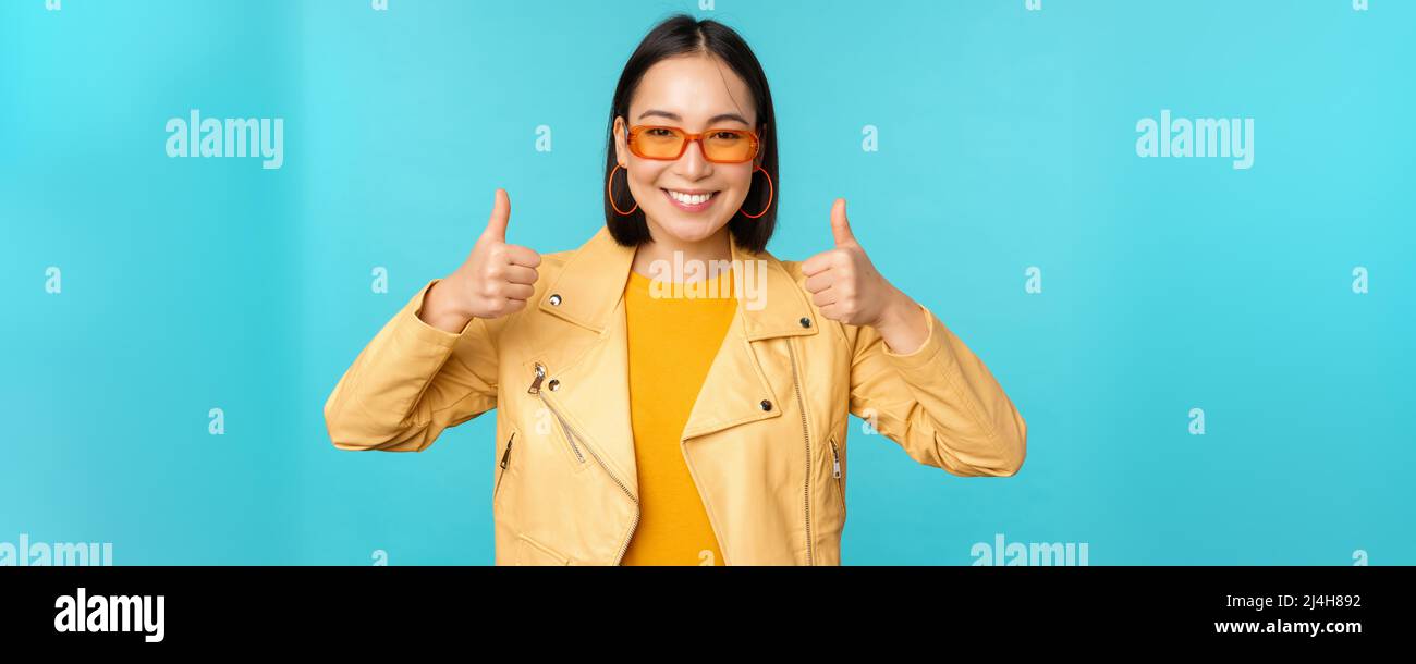 Portrait of modern young asian chinese woman in sunglasses, wears ...