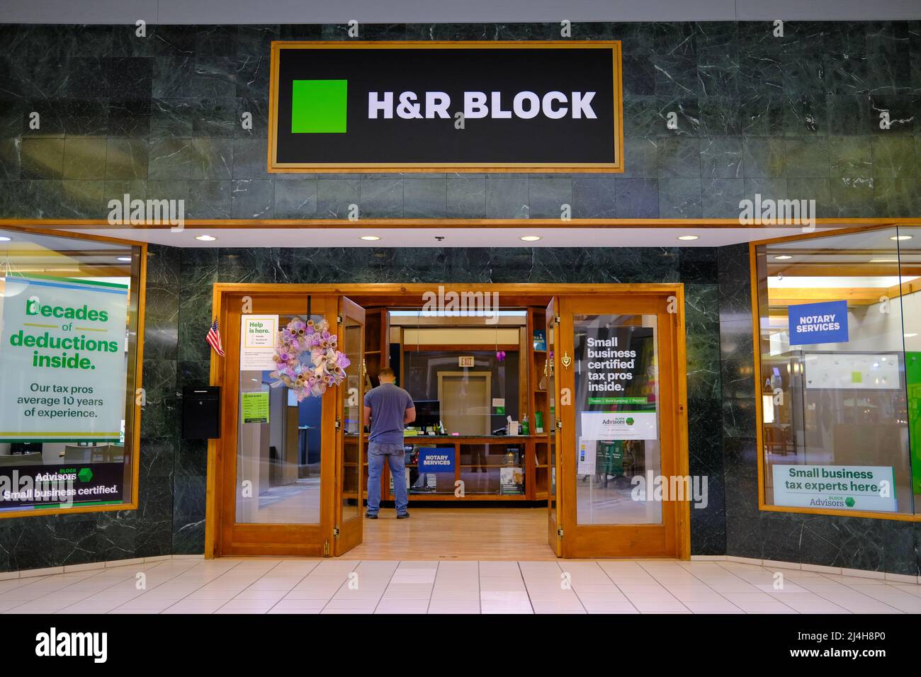A man seen inside an H&R Block tax preparation location at the Susquehanna Valley Mall. Stock Photo