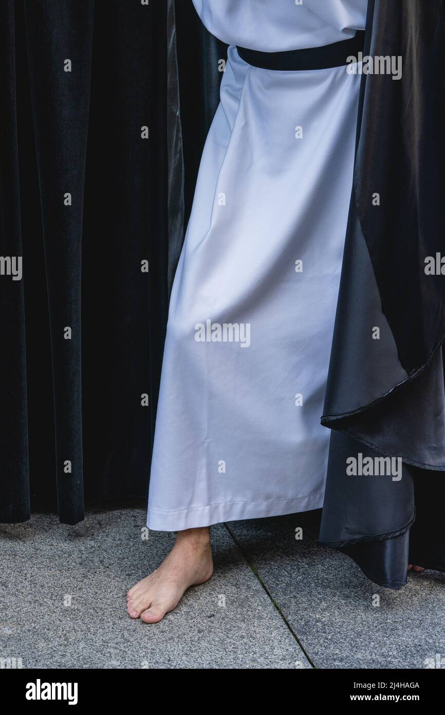 Barefoot man parading in Holy Week procession in the city of Aviles in Asturias. Stock Photo