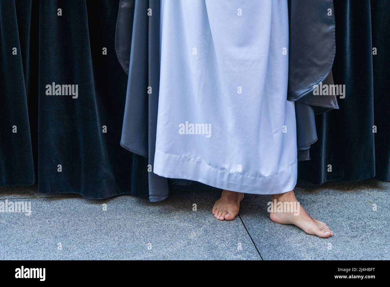 Barefoot man parading in Holy Week procession in the city of Aviles in Asturias. Stock Photo