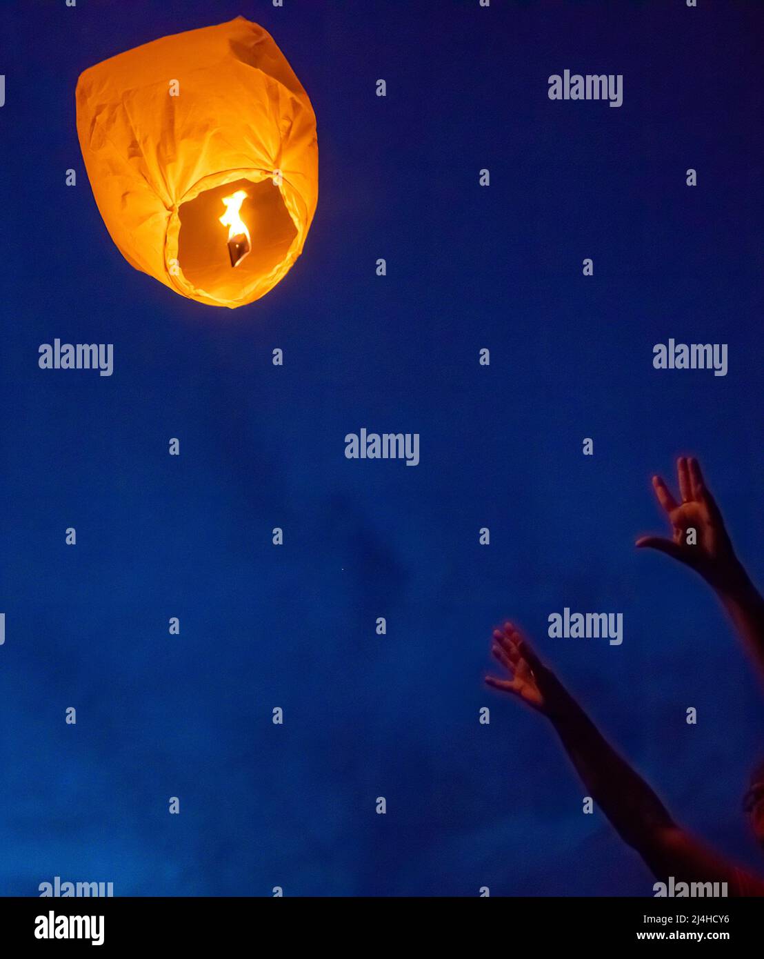 Launching the flame lanterns into the night sky Stock Photo Alamy