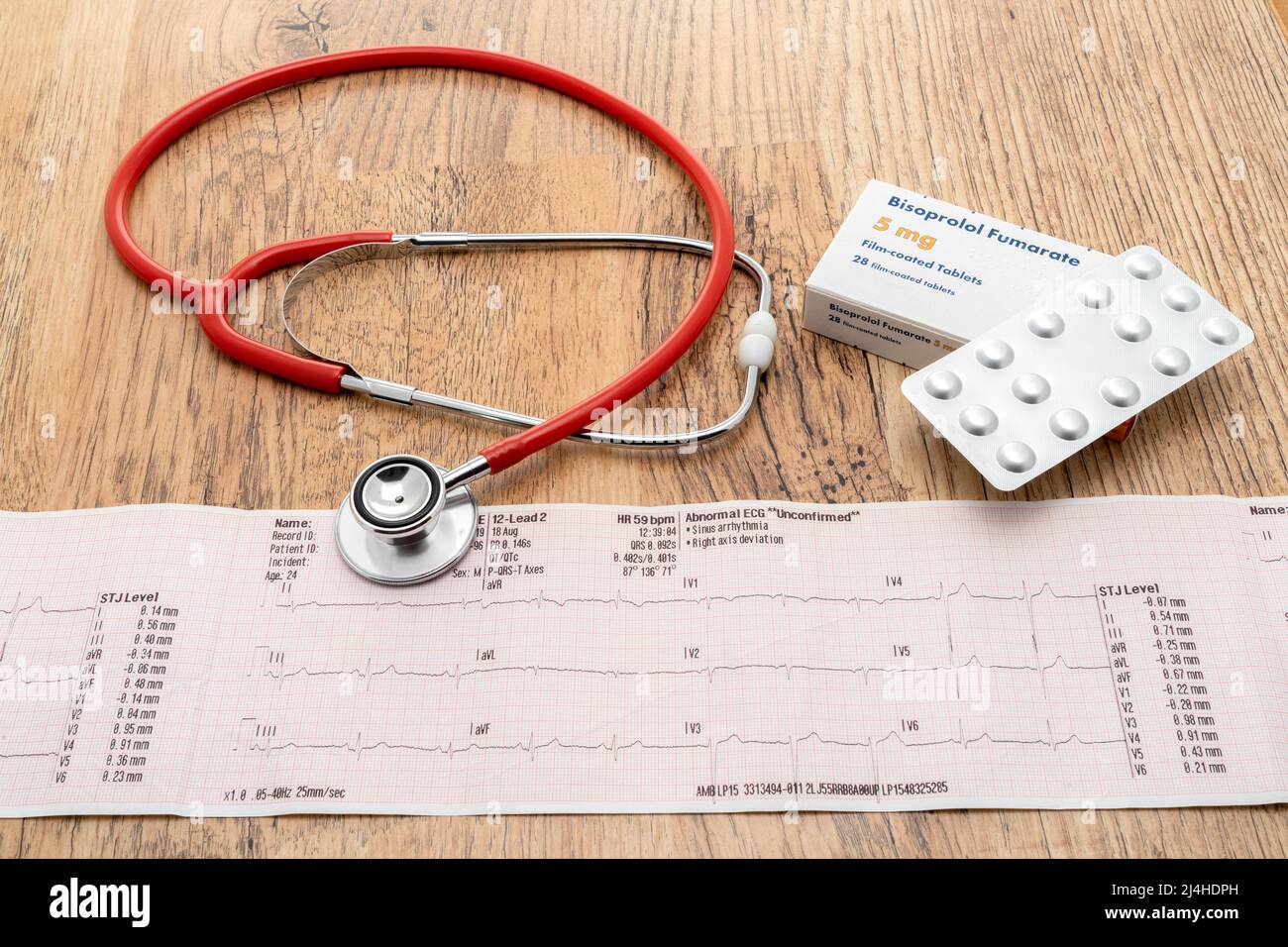 A heart trace ECG with a generic box of Bisoprolol beta blocker pills and a stethoscope Stock Photo