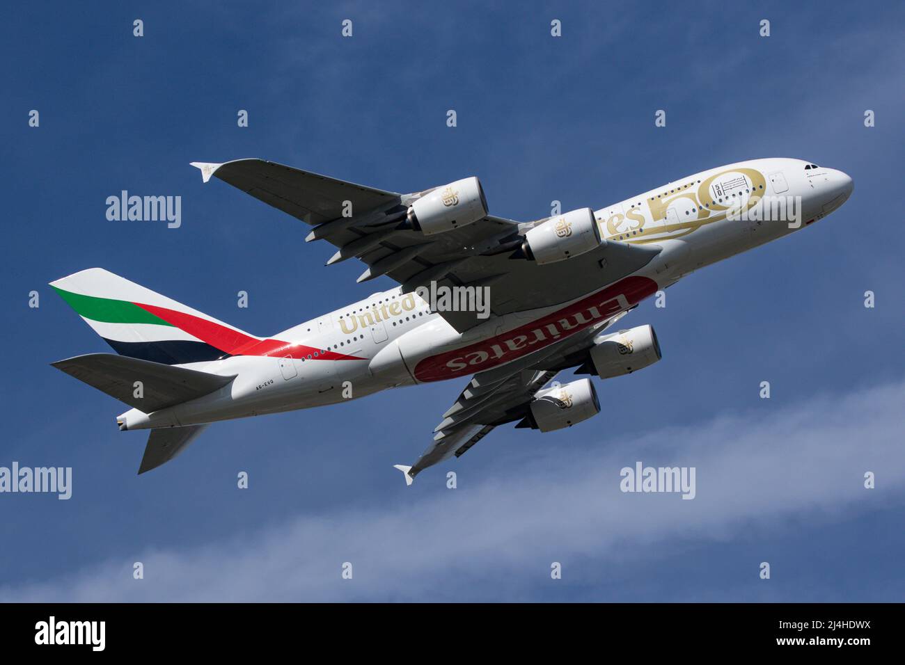 An Airbus A380 operated by Emirates, wearing a special livery for the 50th Anniversary of the UAE departs from London Heathrow Airport Stock Photo