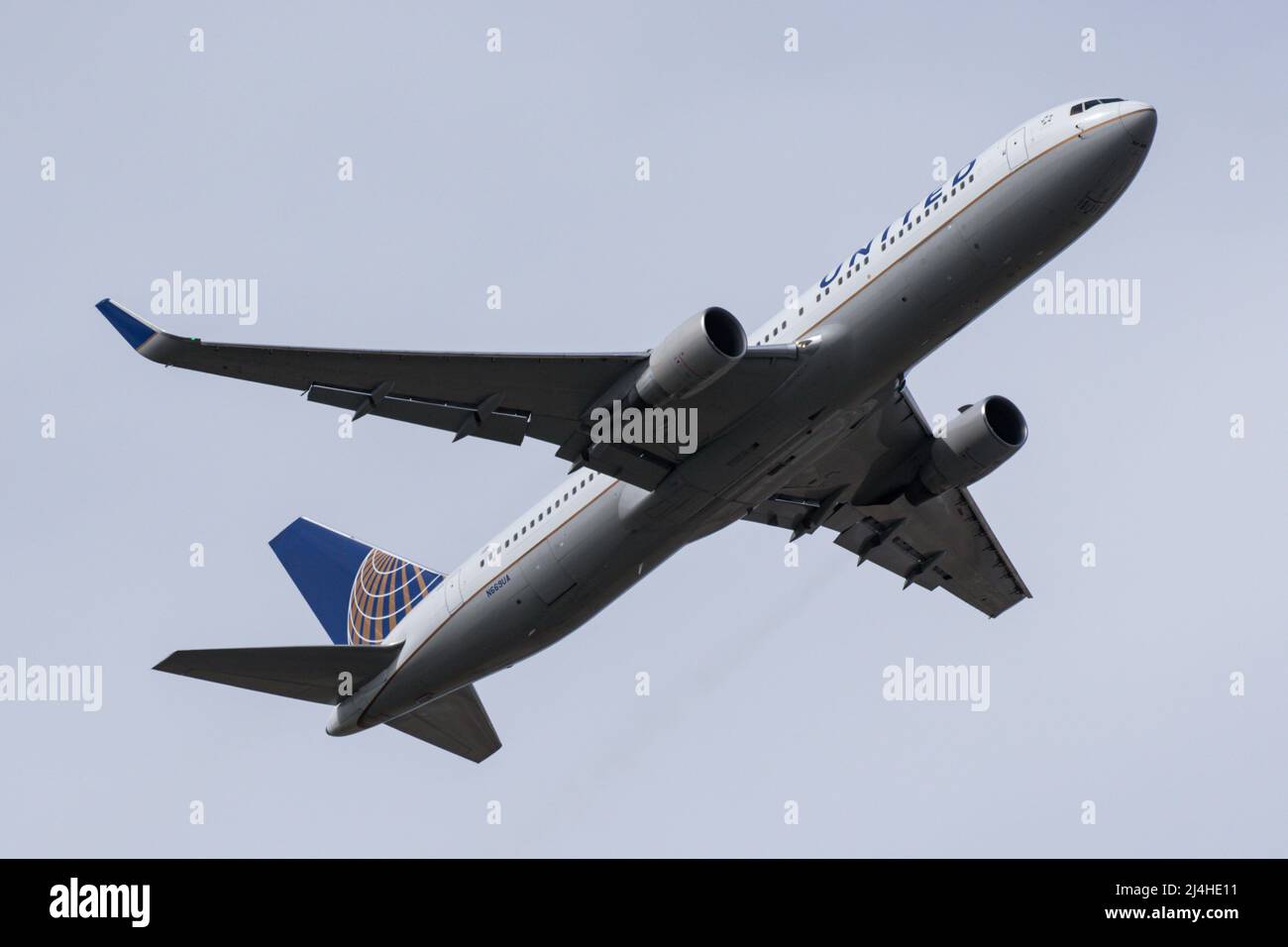 A Boeing 767 operated by United Airlines departs from London Heathrow Airport Stock Photo