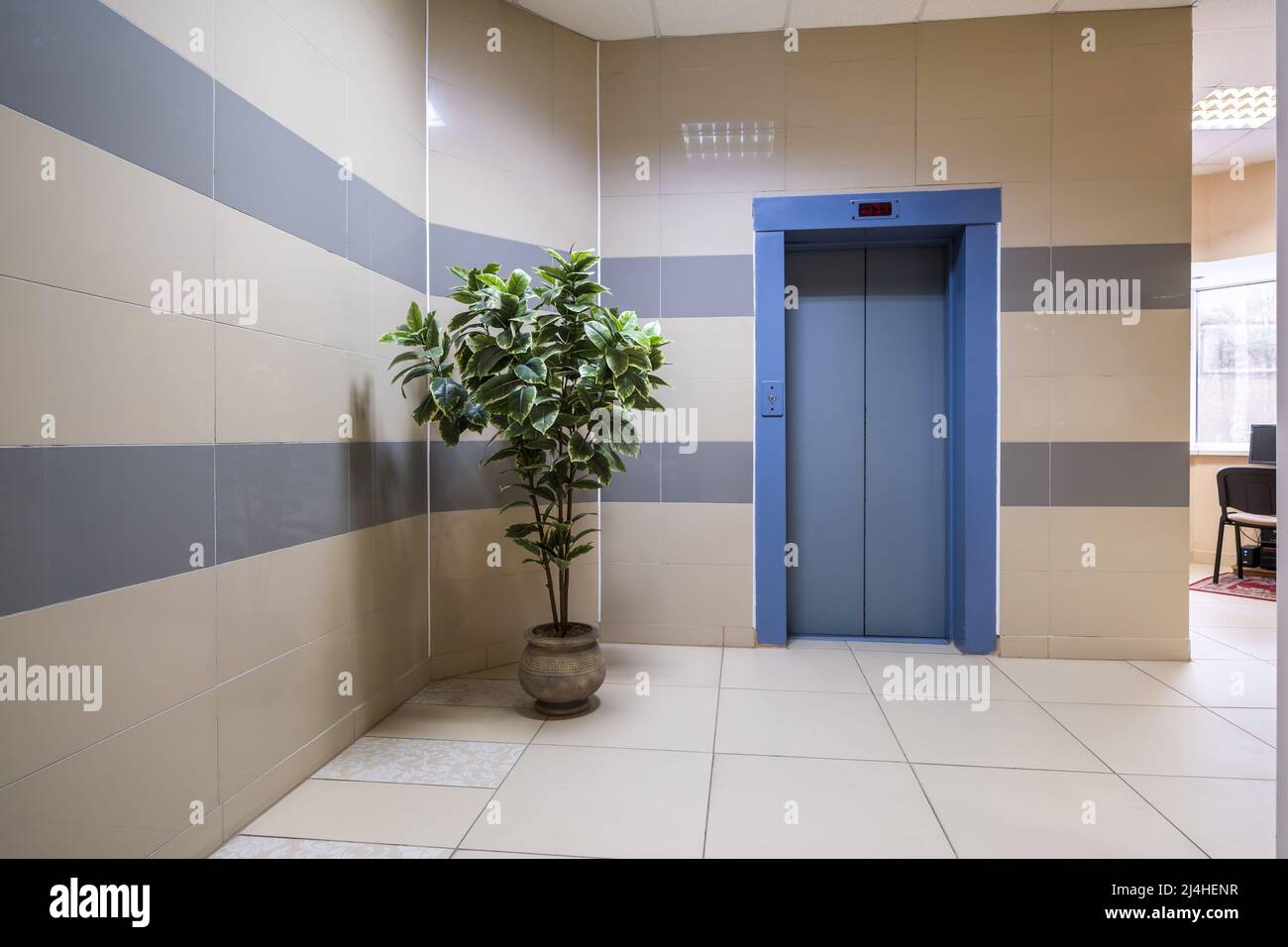 staircase hall in an apartment building at the entrance to the elevator