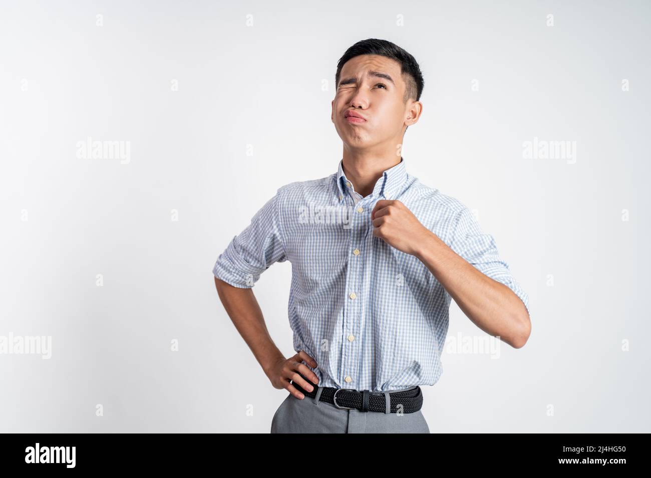 young asian man with tshirt feeling hot weather Stock Photo