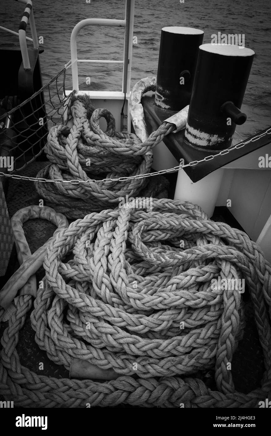 on a deck of a ship lie long ropes for mooring the ship Stock Photo