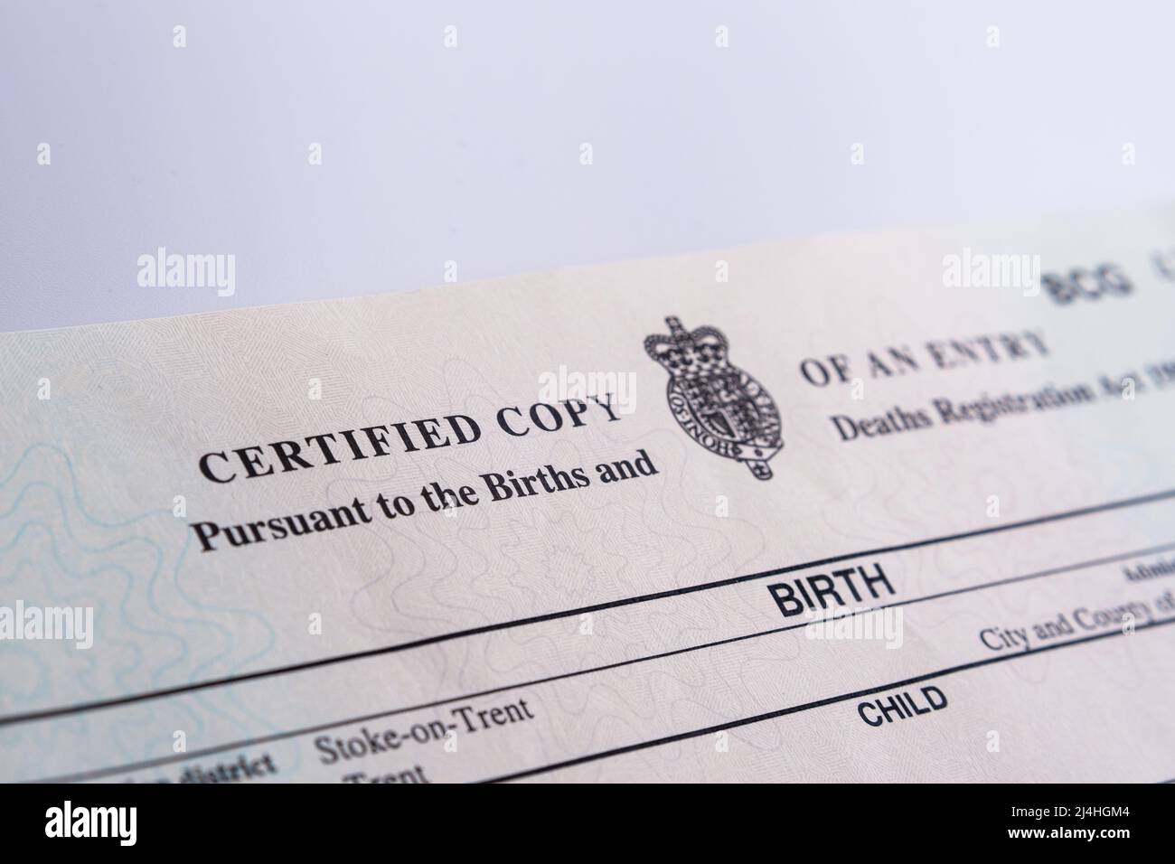Two Birth Certificates released by HM Passport Office in 2021. Selective focus. Stoke-on-Trent, United Kingdom, April 13, 2022. Stock Photo
