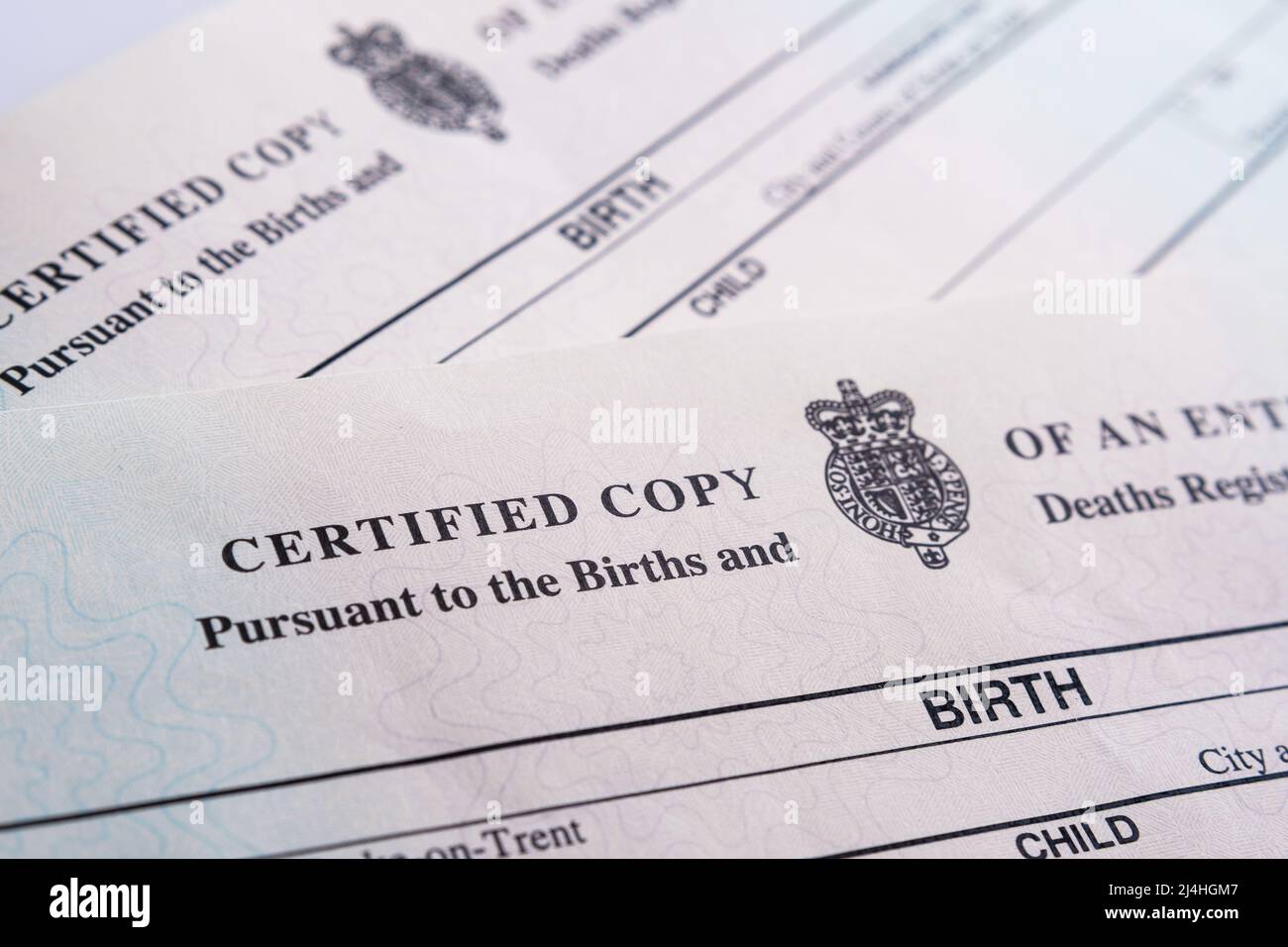 Two Birth Certificates released by HM Passport Office in 2021. Selective focus. Stoke-on-Trent, United Kingdom, April 13, 2022. Stock Photo