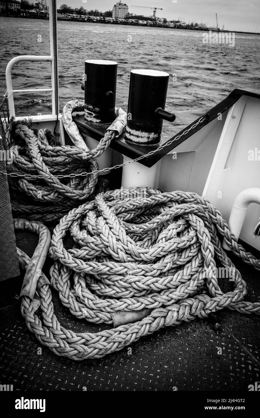 on a deck of a ship lie long ropes for mooring the ship Stock Photo