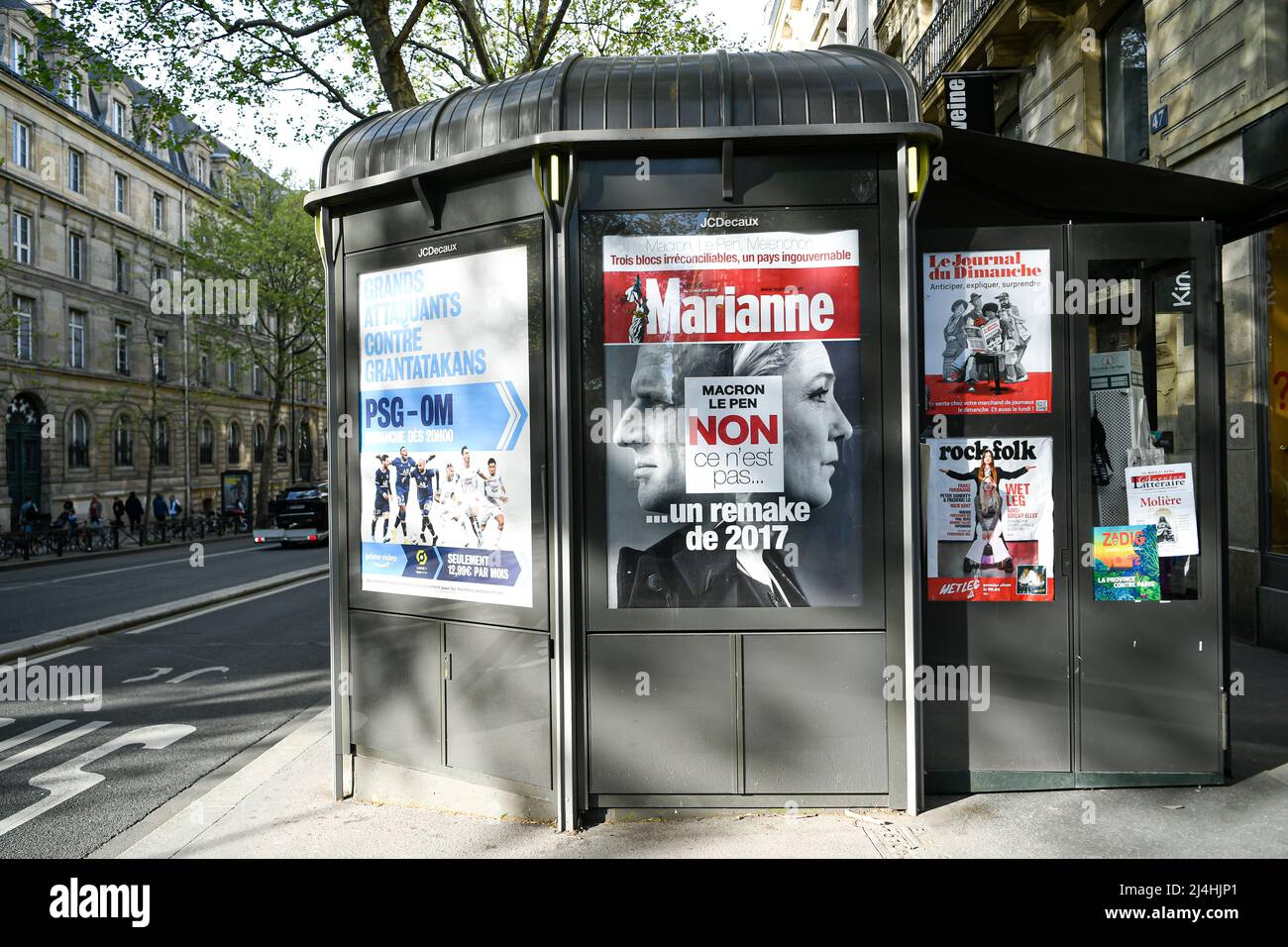 Illustration of the second round of the French presidential election between current president Emmanuel Macron and Marine Le Pen ('RN', 'Rassemblement National'), front page of the French weekly newspaper 'Marianne' on a newsstand in Paris, France on April 15, 2022. Stock Photo