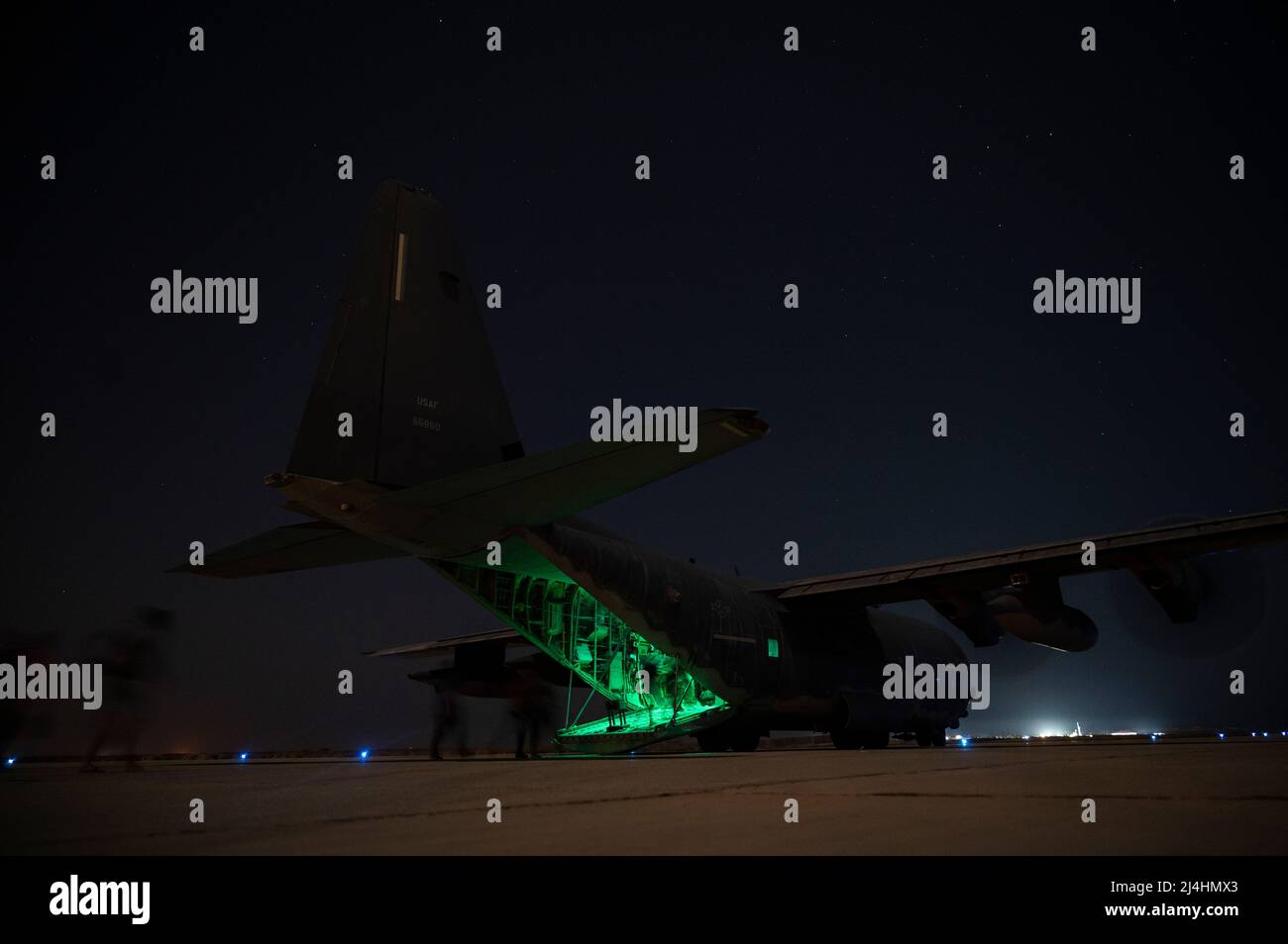 U.S. special operators load onto an MC-130J Commando II assigned to the 9th Expeditionary Special Operations Squadron at an undisclosed location in the U.S. Central Command area of responsibility, Nov. 19, 2021. The MC-130J provides infiltration, exfiltration and resupply of special operations forces and equipment in hostile or denied territory. Secondary missions include psychological operations, and helicopter and vertical lift air refueling. (U.S. Air Force photo by Staff Sgt. Joseph Pick) Stock Photo