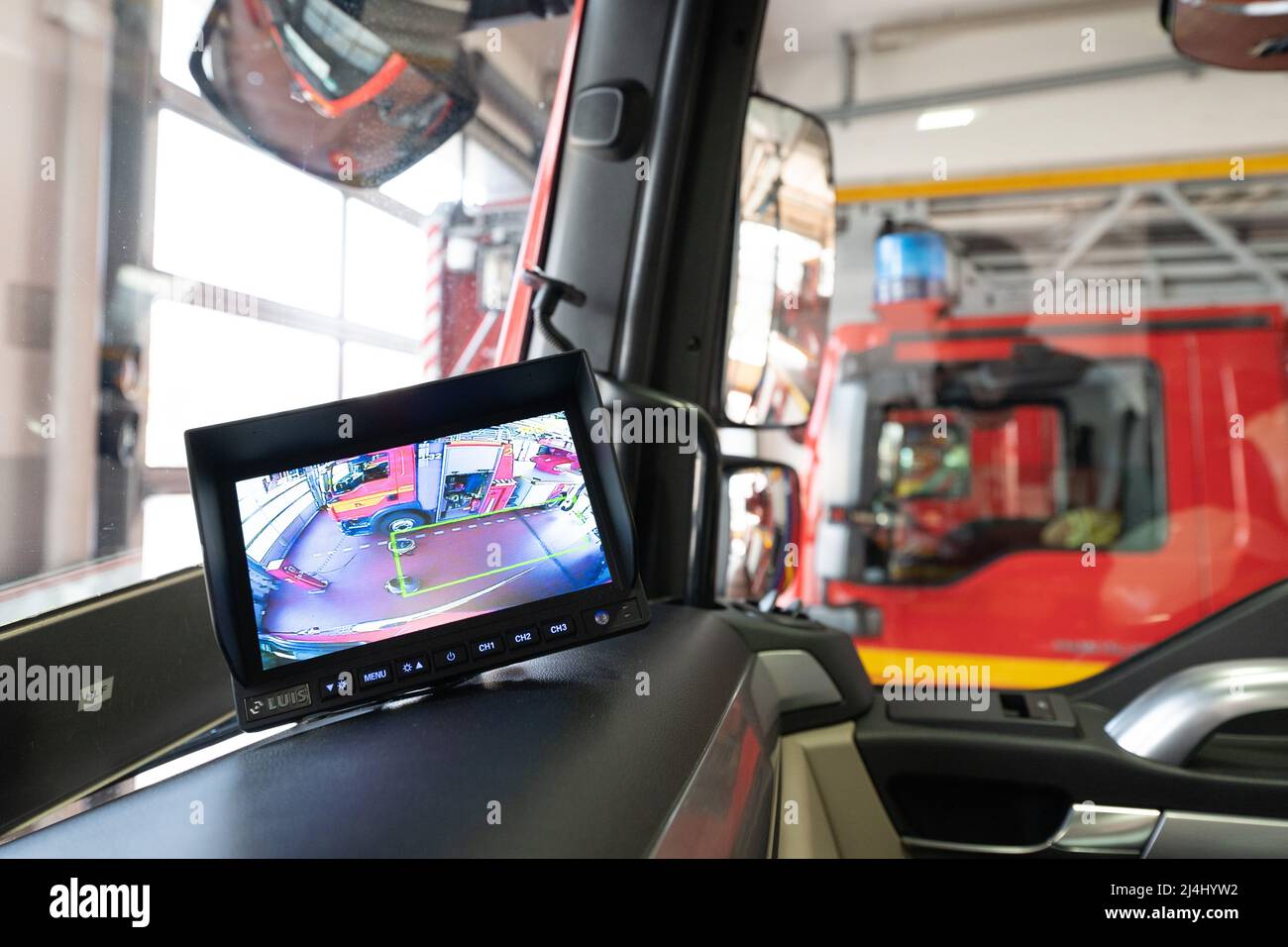 Dresden, Germany. 13th Apr, 2022. The additional monitor of a turn-off assistant is installed on the dashboard of an auxiliary fire-fighting group vehicle of the Dresden fire department. From July 2022, turn assist systems will be mandatory for newly registered truck types in the EU to prevent accidents between trucks turning right and cyclists. (to dpa 'Municipal fleets equip trucks with turn assist') Credit: Sebastian Kahnert/dpa/Alamy Live News Stock Photo
