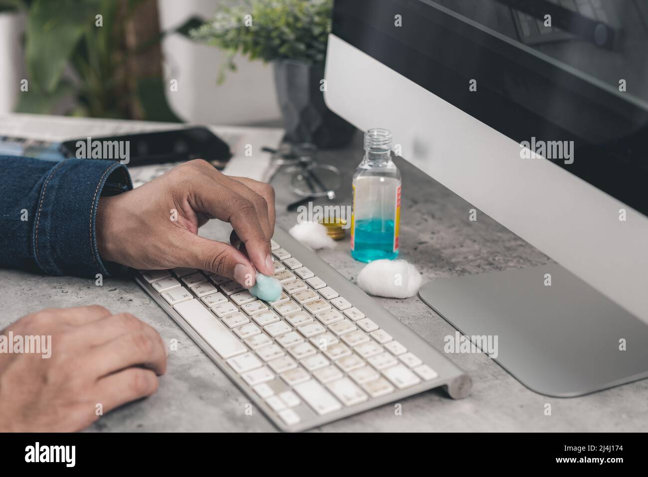 The man cleaning his computer keyboard. Grimy, more bacteria on keyboard Stock Photo Alamy