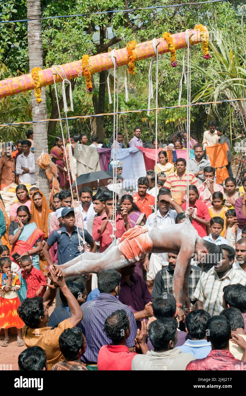 Devotees fulfilling vow by hanging with hooks in Thaipusam Festival in  Kerala India 01 30 2010 Stock Photo - Alamy