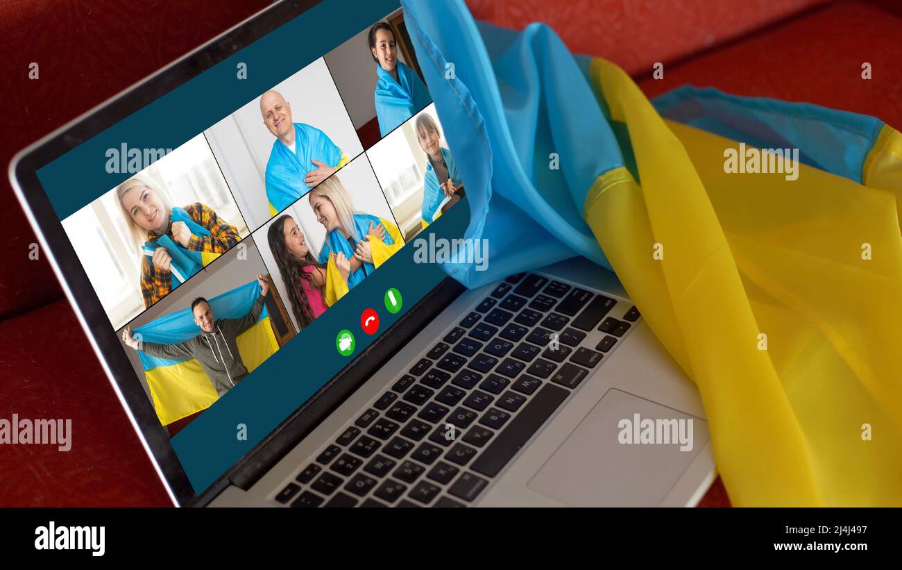 laptop near the ukraine flag. online conference Stock Photo Alamy