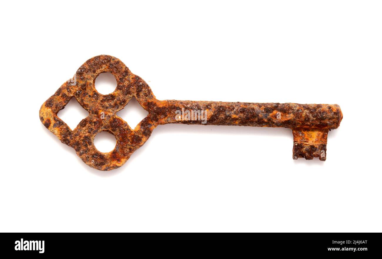 Old very rusty key isolated on white background Stock Photo - Alamy