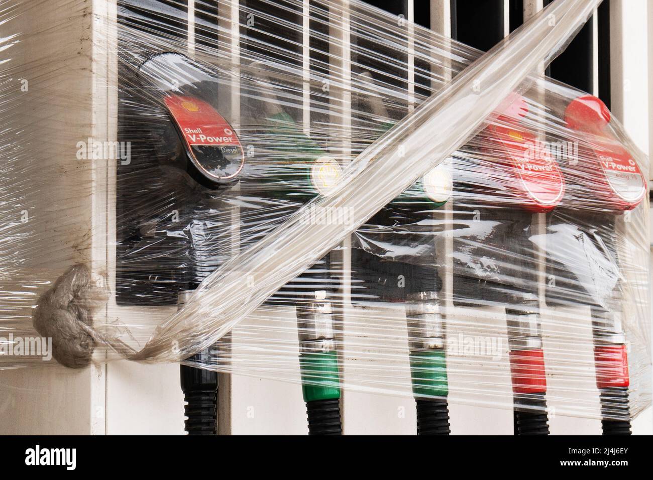 Moscow, Russia April 13, 2022 Fuel nozzles tied with plastic wrap at