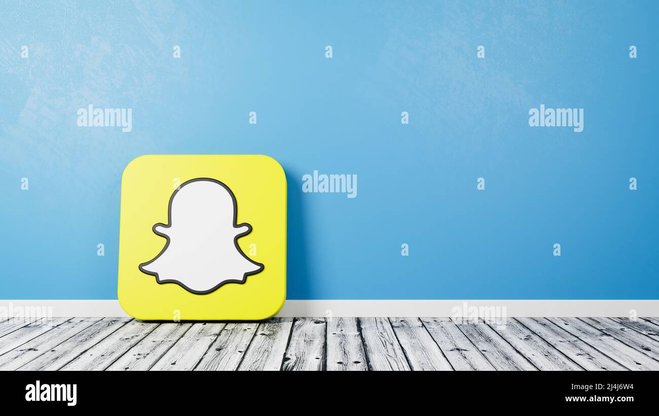Snapchat Logo on Wooden Floor Against Wall Stock Photo