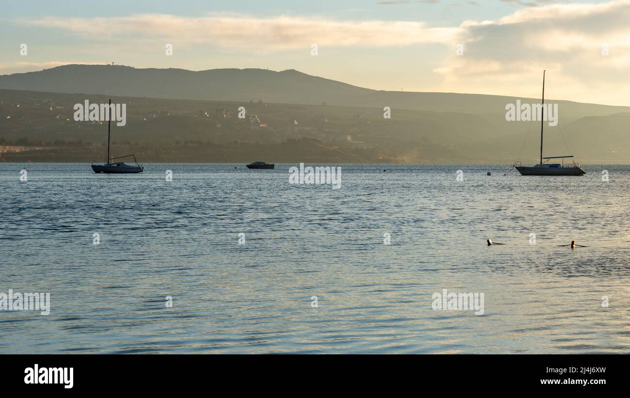 Tbilisi sea and boat with deflated sails. Landscape. Sunrise Stock Photo