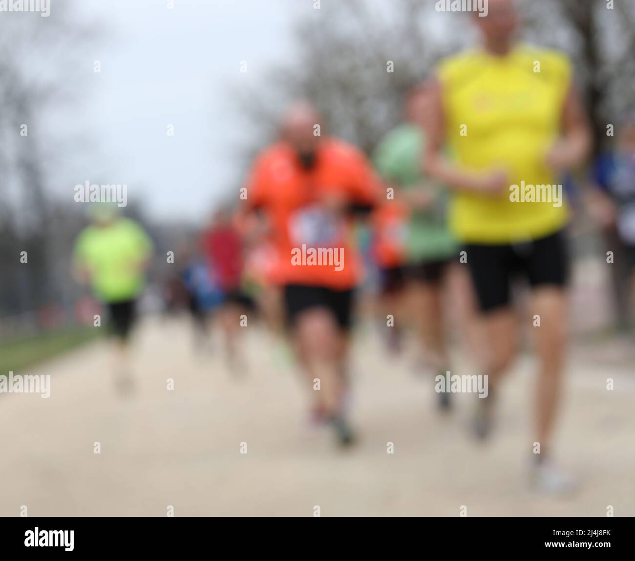 Intentionally blurred background with many runners during the foot race ...