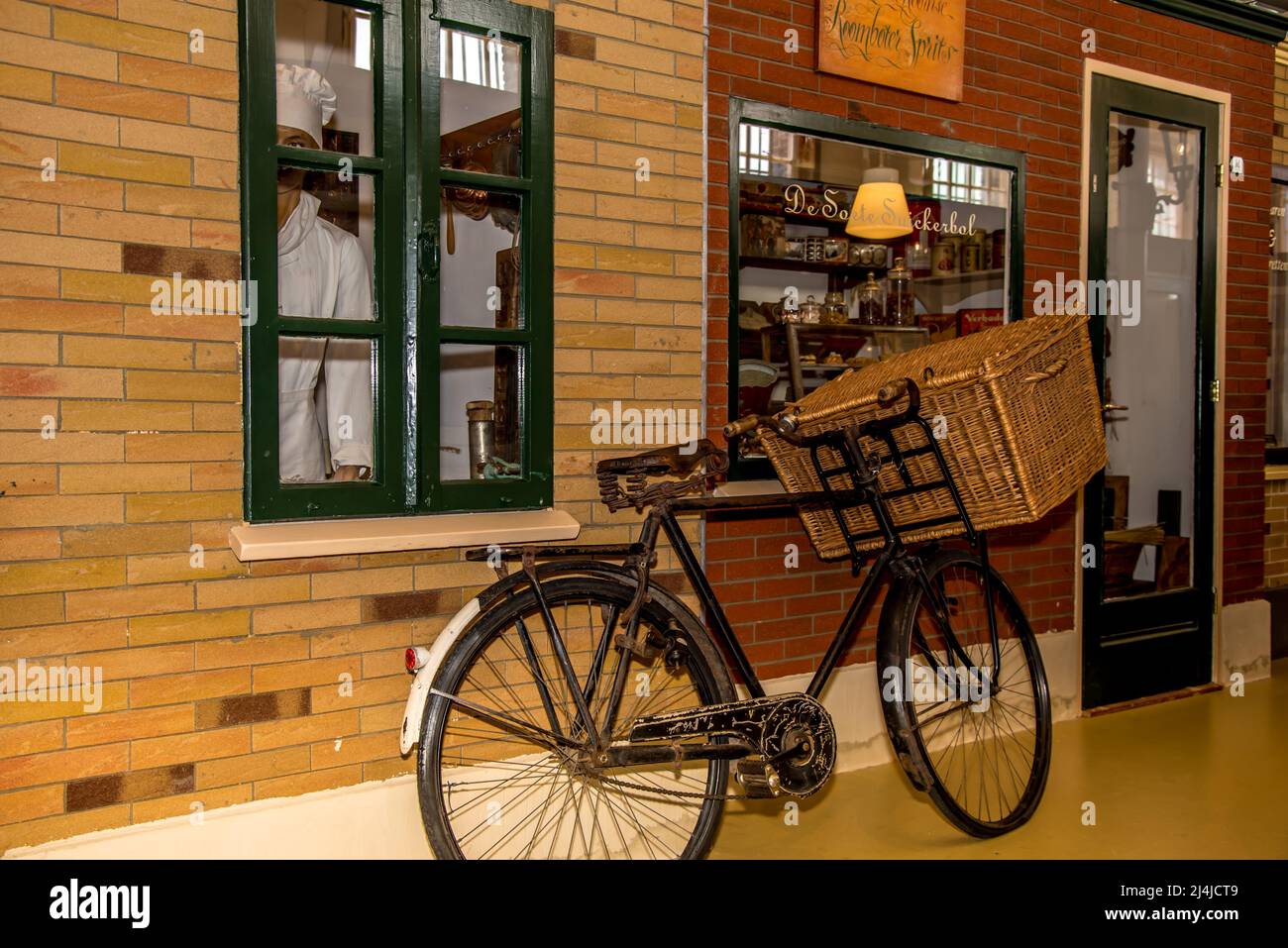 Hoorn, Netherlands, March 2022. The facade of a bakery store with an old cargo bike for deliveries. High quality photo Stock Photo