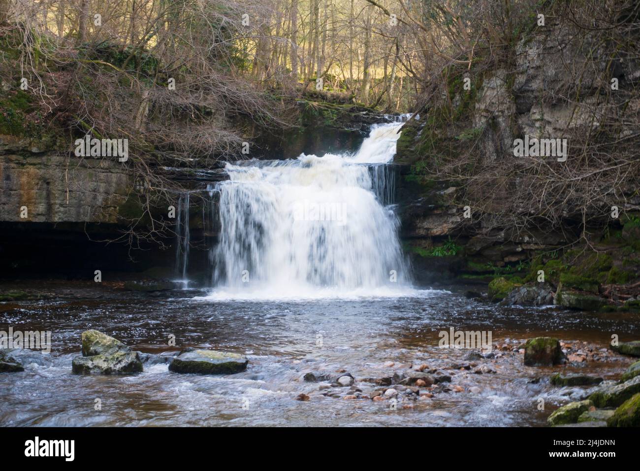 West Burton Falls, Wensleydale, Yorkshire Dales National Park.  Also known as Cauldron Falls, the beautiful waterfall is tucked away in a small villag Stock Photo