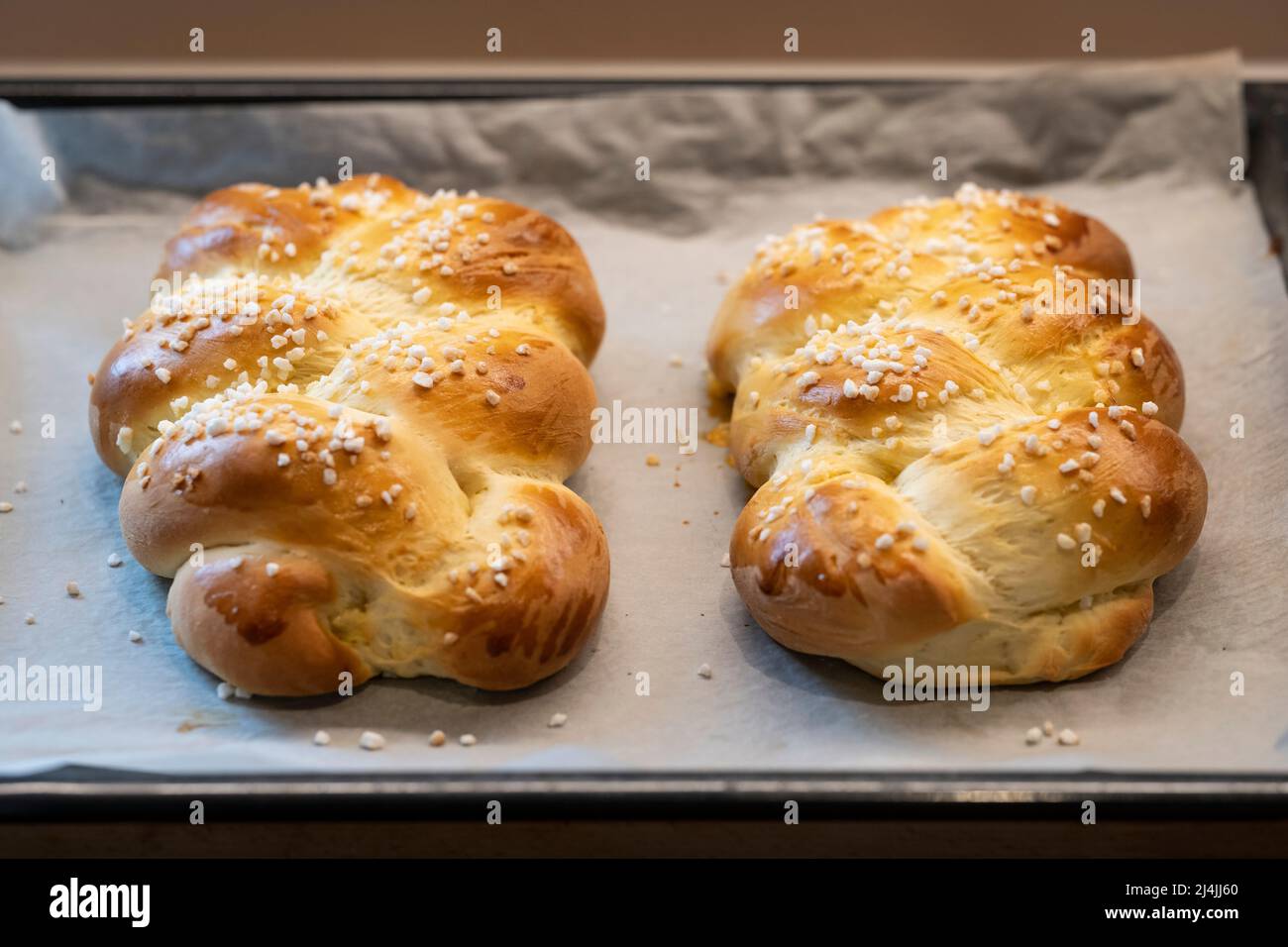 delicious homemade and baked easter braid on the baking tray fresh from the oven Stock Photo