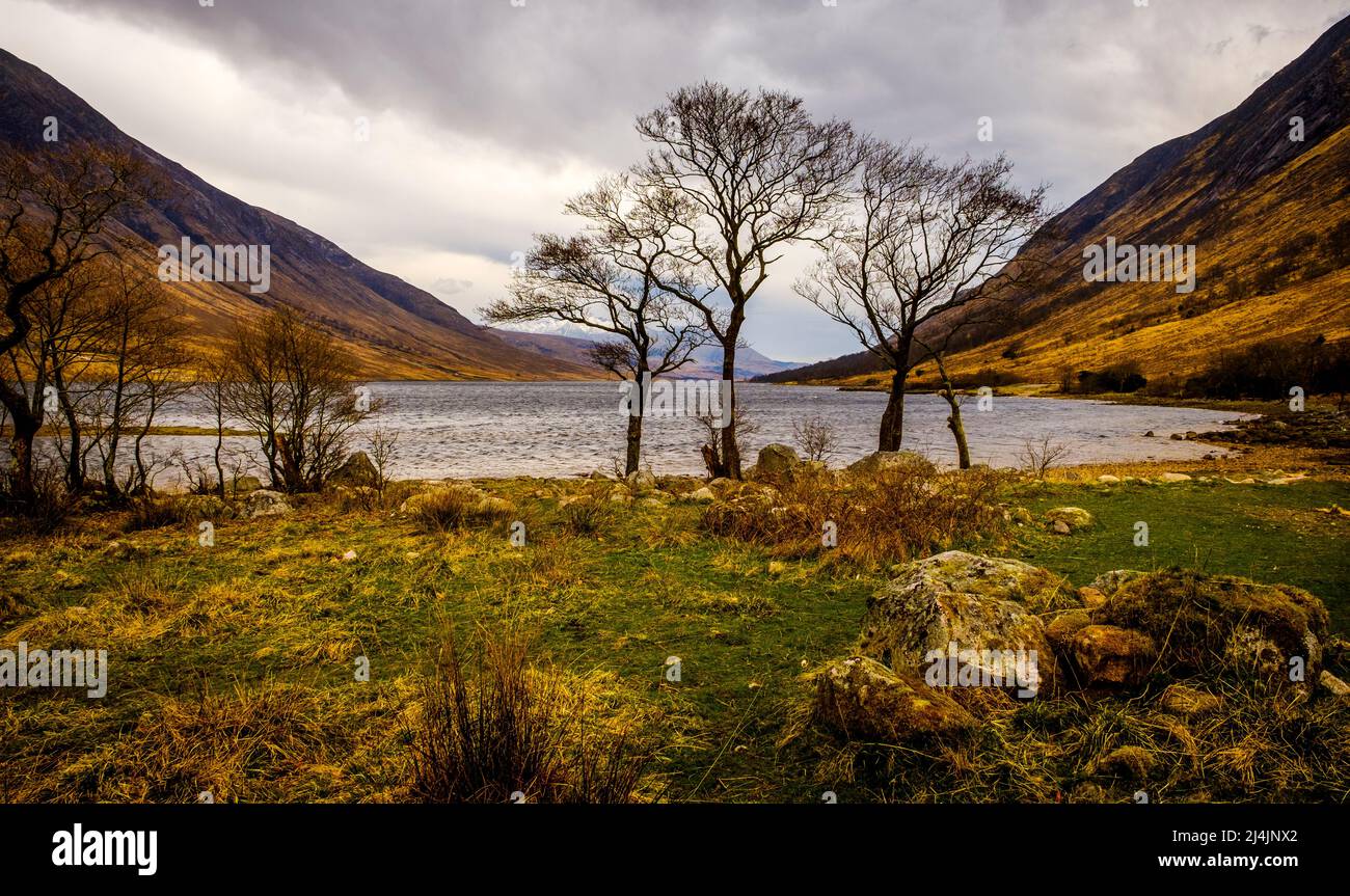 Showery spring weather in Glen Etive at the head of Loch Etive looking towards snow capped Ben Cruachan. Stock Photo