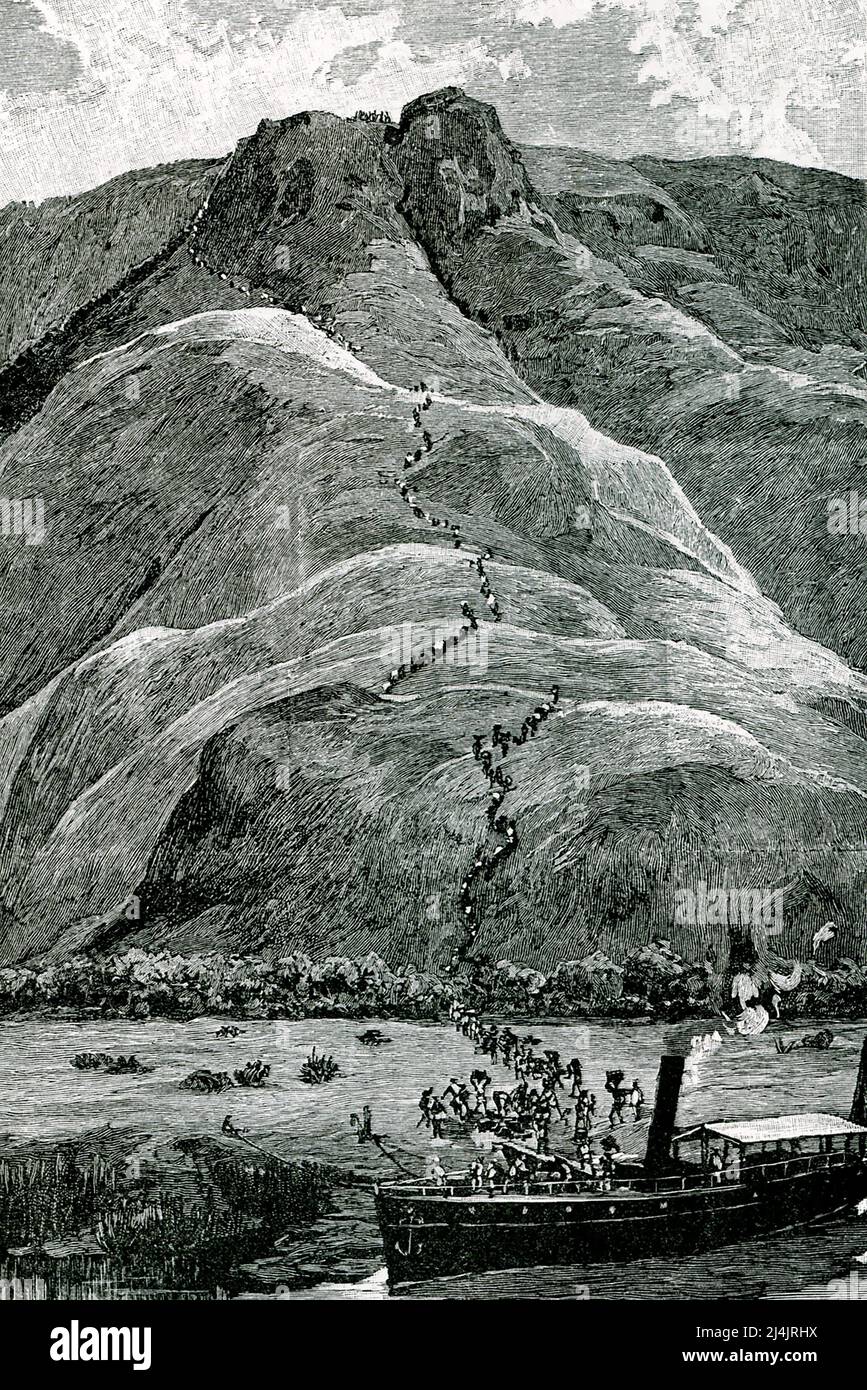 The 1890 caption reads: ' Climbing the Plateau Slopes.' It is from H M Stanley’s book, In Darkest Africa. Sir Henry Morton Stanley (1841-1904) was a British explorer and journalist. In 1871, the New York Herald sent him to Africa to find David Livingstone. On the expedition of 1879-1884, he obtained territorial concessions that led to Belgian acquisition of Congo Free State. Stock Photo