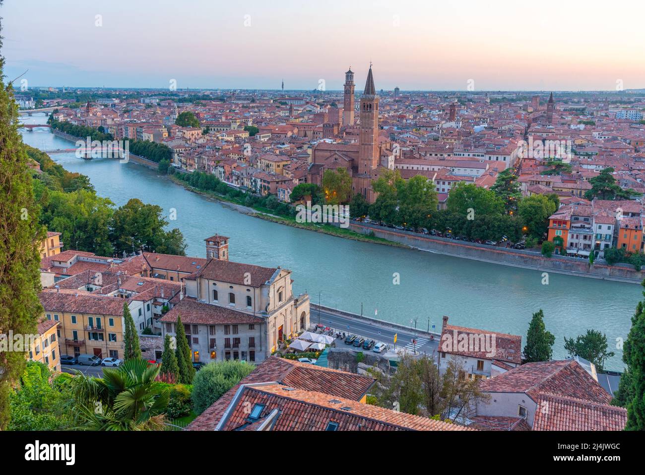 Sunset view of waterfront of the adige river in the italian city verona ...