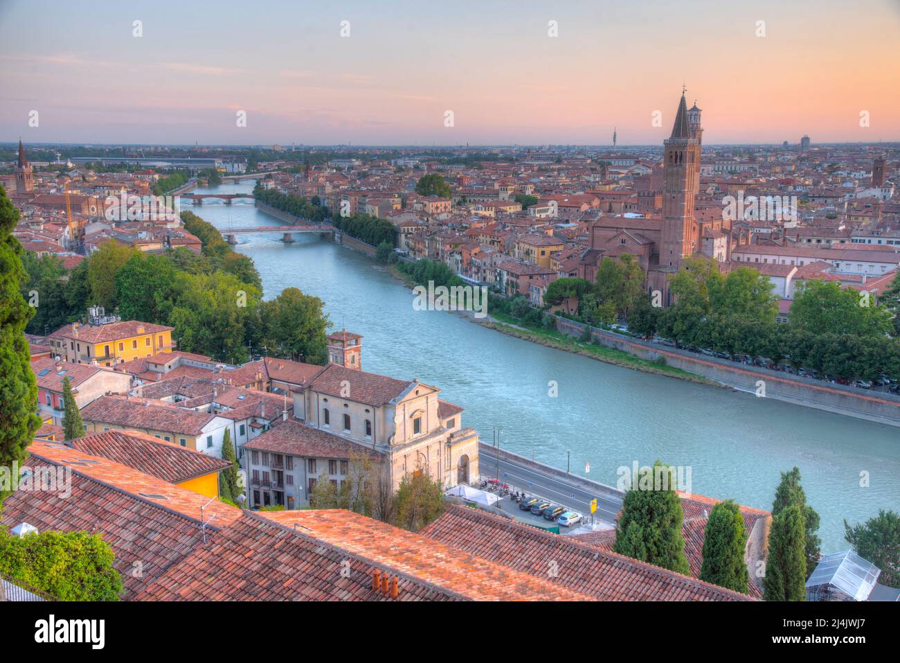 Sunset view of waterfront of the adige river in the italian city verona ...