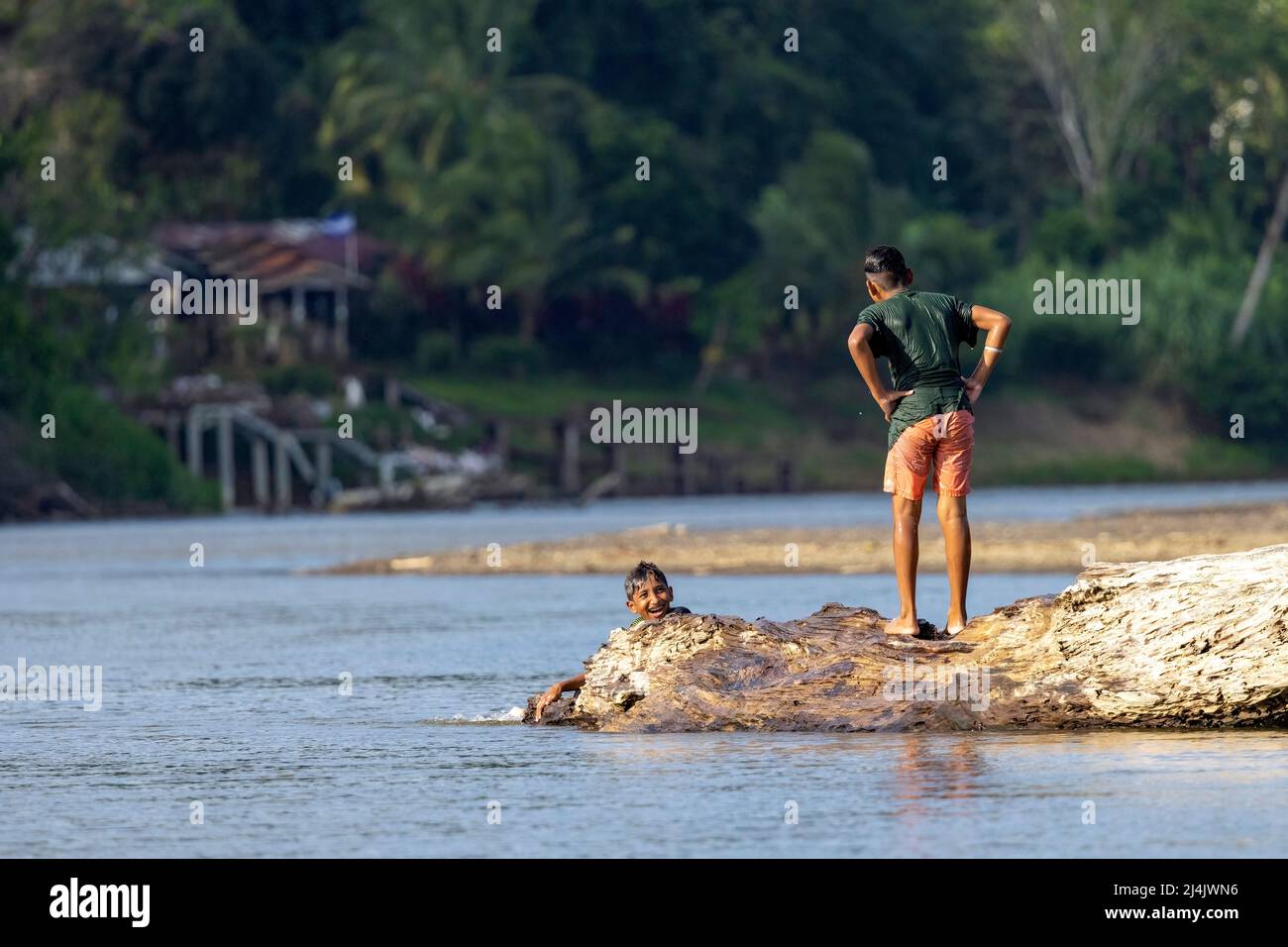 Boys playing in the San Carlos River - near Boca San Carlos, Costa Rica Stock Photo
