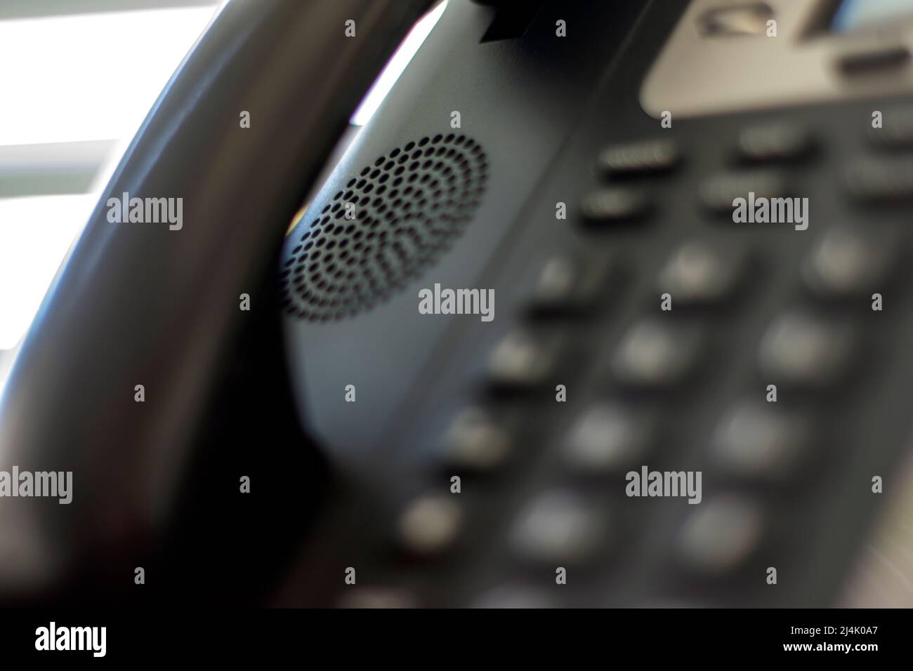 Corporative gear, Telephone and speaker close-up. Call centers and phone lines used on services and remote assistance. Spying communications. Stock Photo