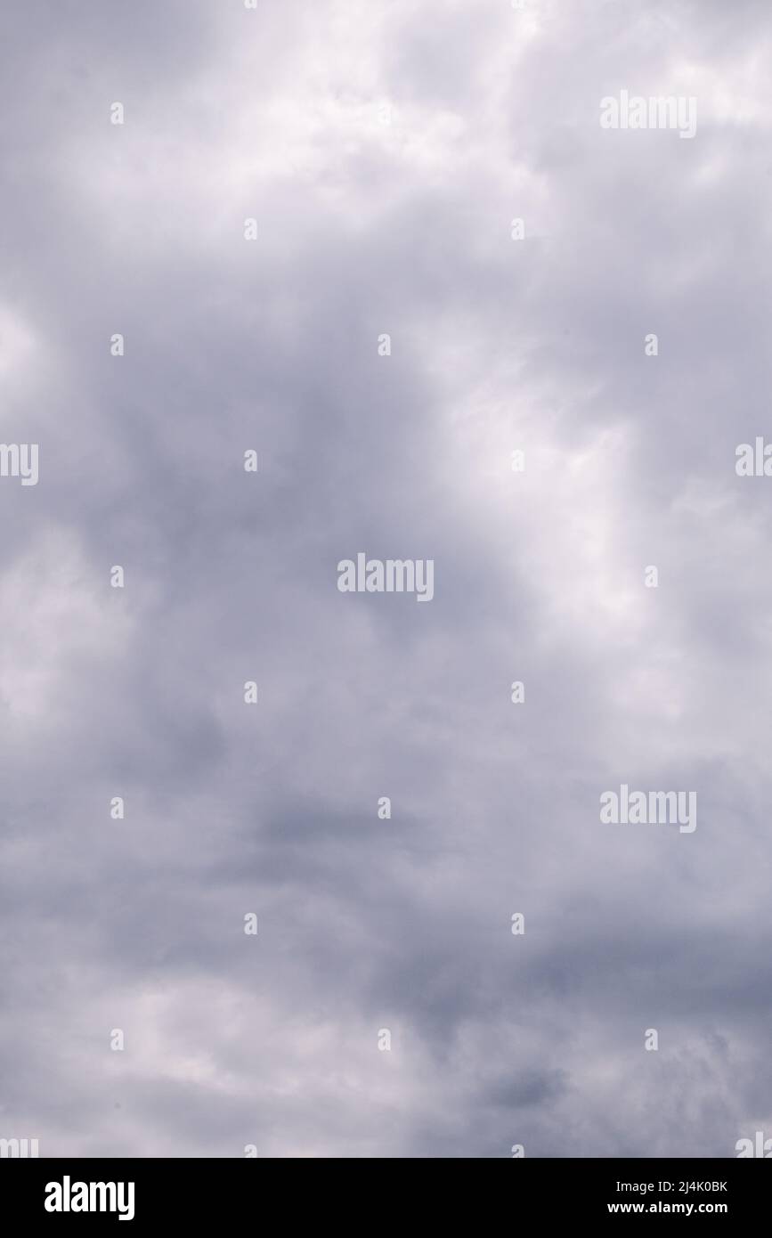 cloudy and gloomy sky. Shades of gray and white in full frame. Stock Photo