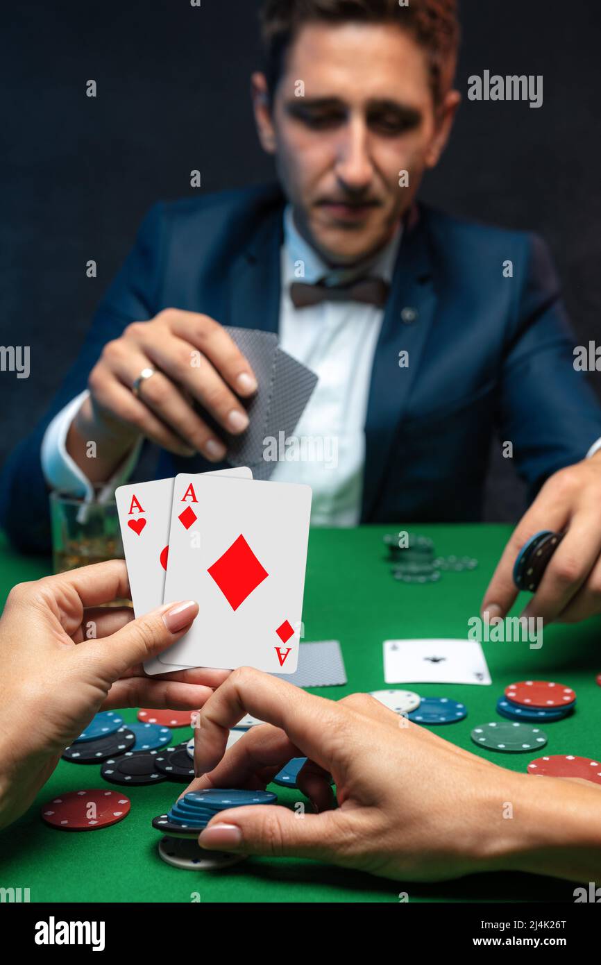 Upset poker player in casino with bad poker cards. Stock Photo