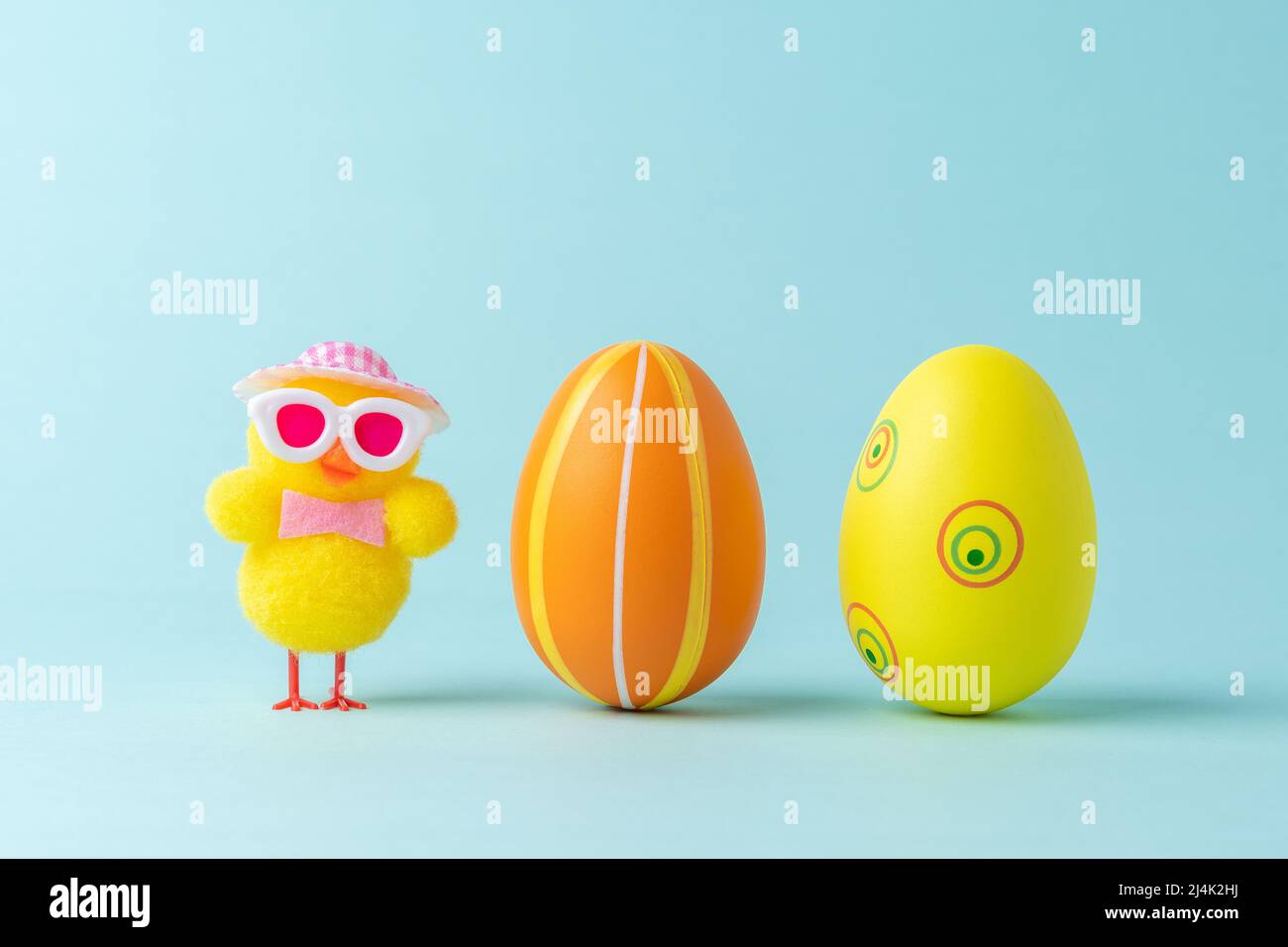 Holiday layout with colorful easter eggs and chicken. Easter minimal concept. Creative Happy Easter or spring layout. Stock Photo