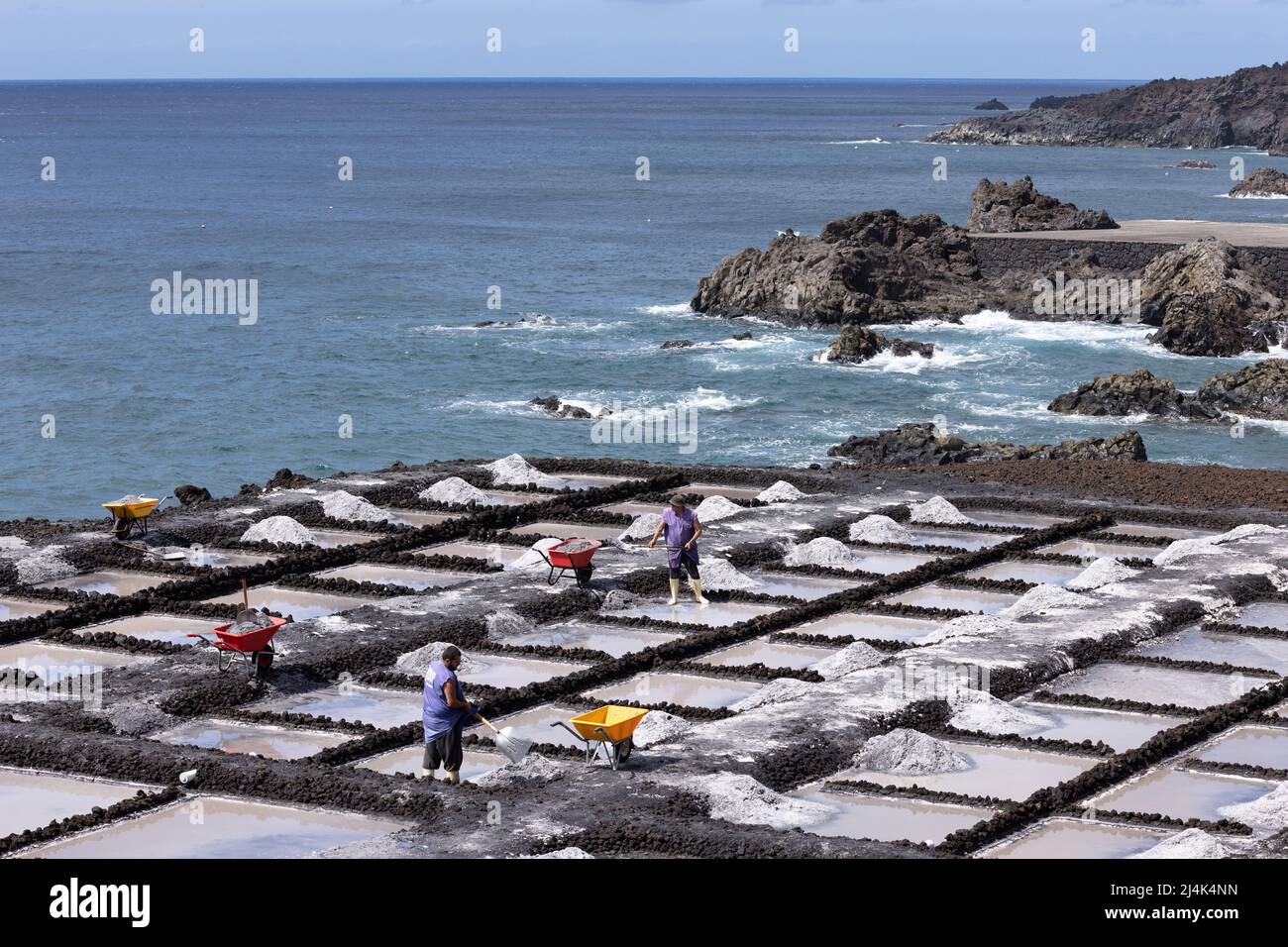 La Palma Island Spain - March 04, 2022: Worker at salt extraction near Fuencaliente at La Palma Island Stock Photo