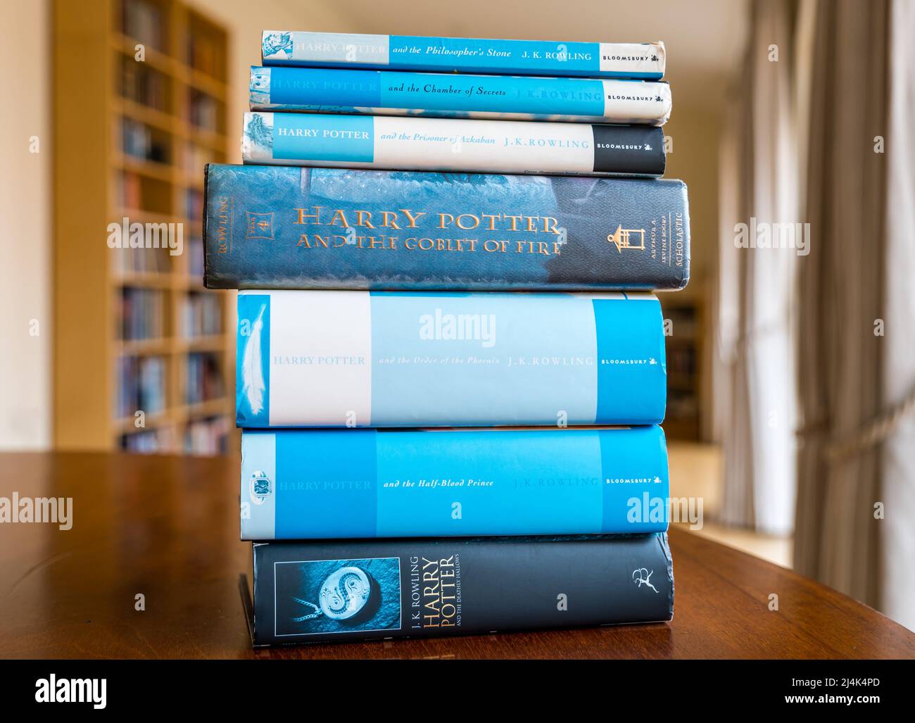 Display of pile of Harry Potter series of books on a table by J K Rowling, UK Stock Photo