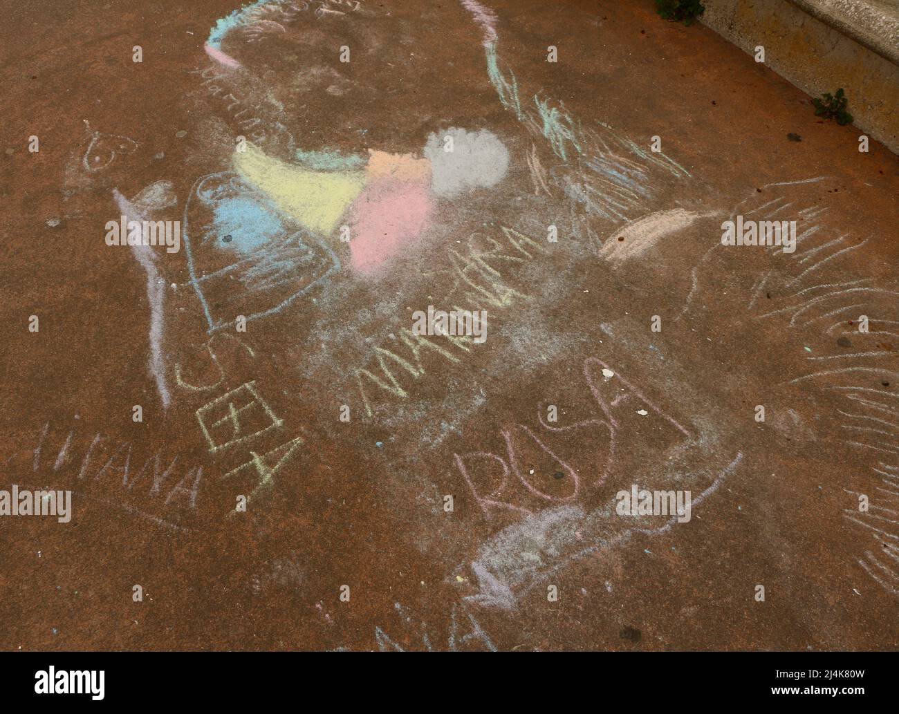 Spanish names and graffiti written in chalk on paving Rosa Sara Aitana