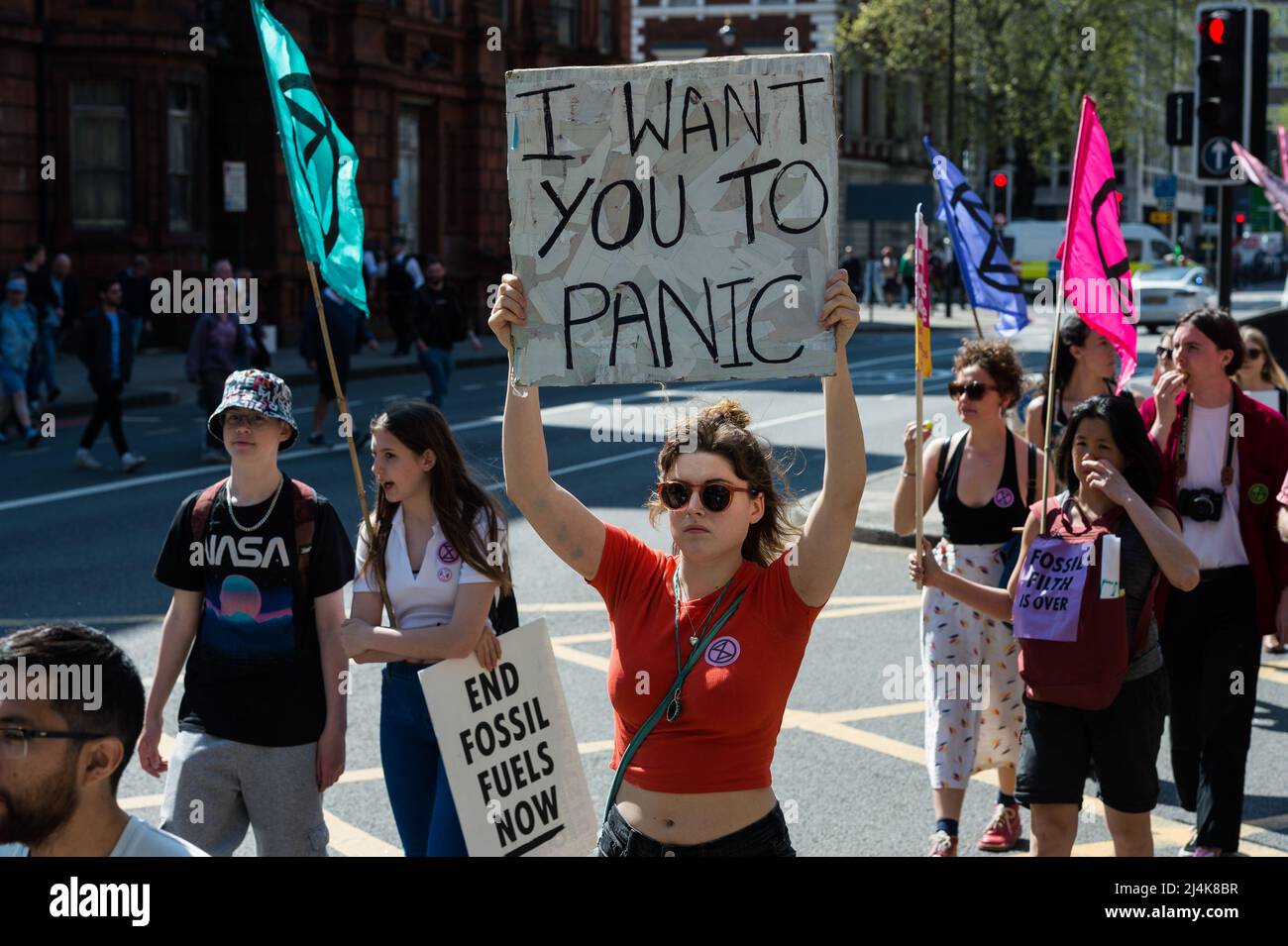 London, UK. 16th April, 2022. Activists from Extinction Rebellion march along Marylebone Road on the eight day of protests and civil disobedience actions to demand an immediate stop to all new fossil fuel infrastructure by the British government amid climate crisis and ecological emergency. Credit: Wiktor Szymanowicz/Alamy Live News Stock Photo