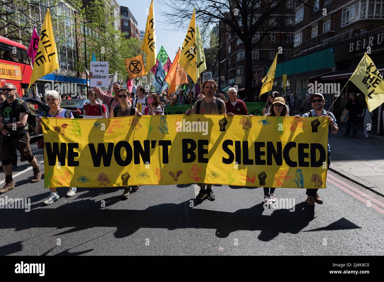 London, UK. 16th April, 2022. Activists from Extinction Rebellion march along Edgware Road on the eight day of protests and civil disobedience actions to demand an immediate stop to all new fossil fuel infrastructure by the British government amid climate crisis and ecological emergency. Credit: Wiktor Szymanowicz/Alamy Live News Stock Photo