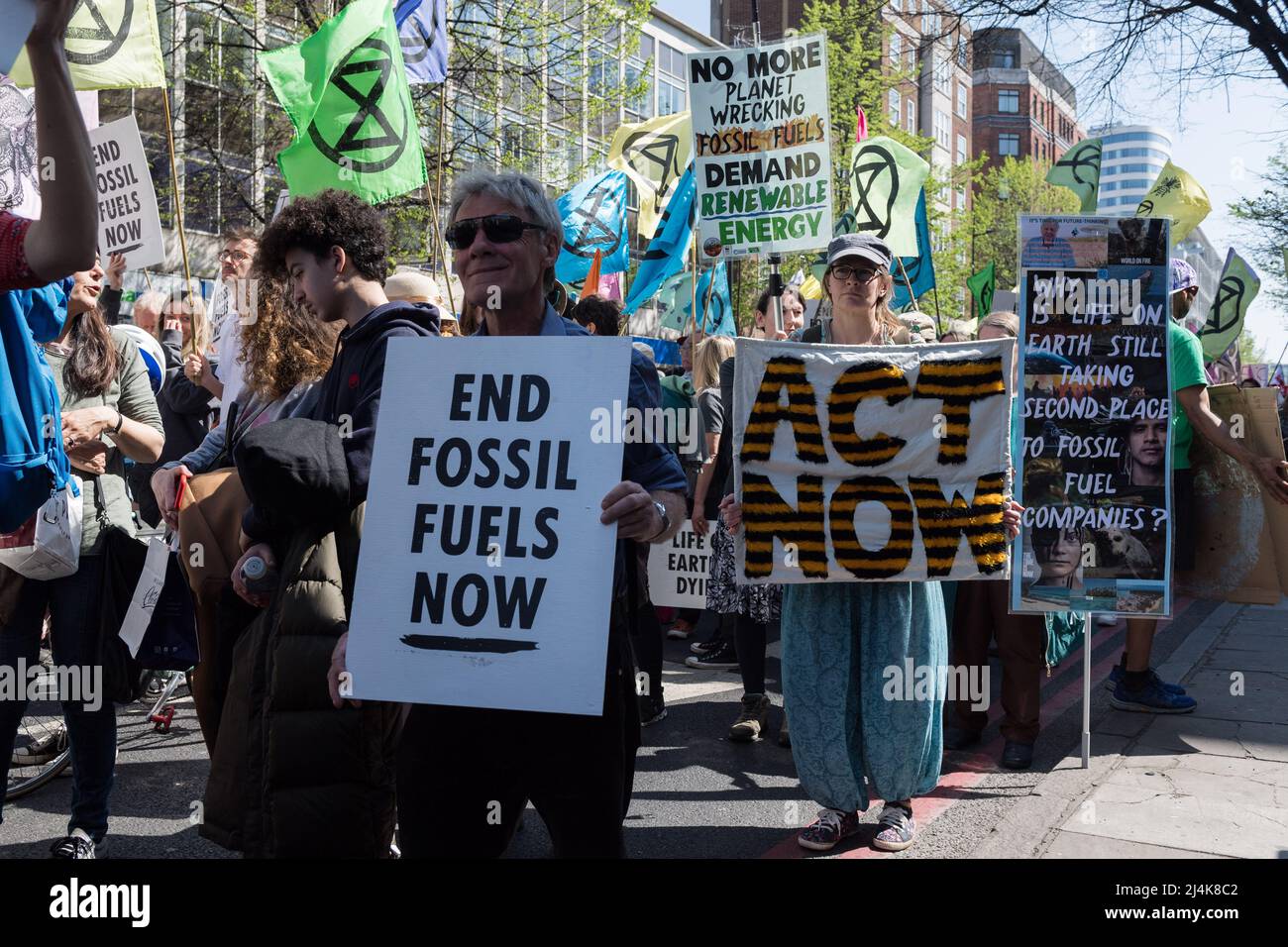 London, UK. 16th April, 2022. Activists from Extinction Rebellion march along Edgware Road on the eight day of protests and civil disobedience actions to demand an immediate stop to all new fossil fuel infrastructure by the British government amid climate crisis and ecological emergency. Credit: Wiktor Szymanowicz/Alamy Live News Stock Photo