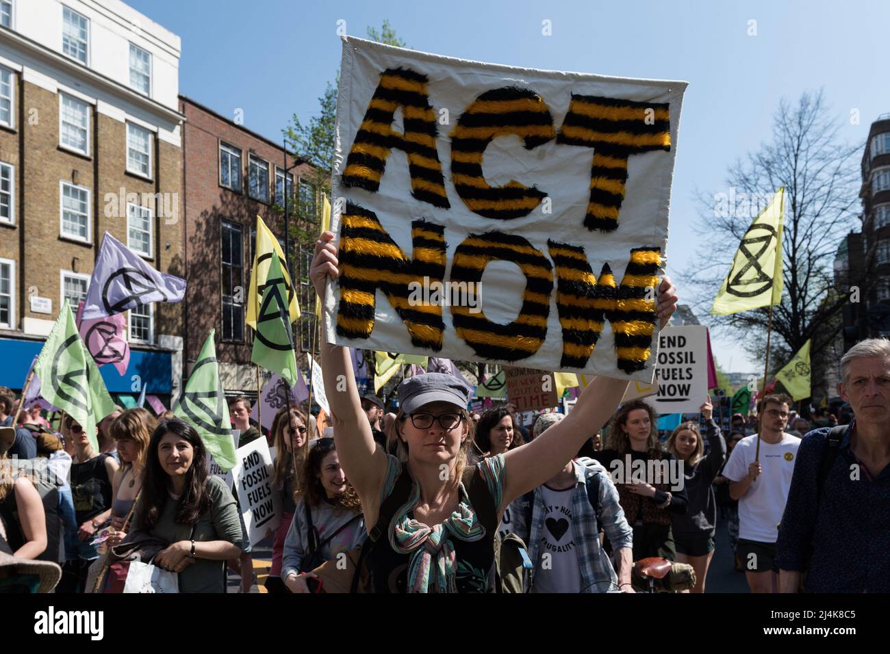 London, UK. 16th April, 2022. Activists from Extinction Rebellion march along Edgware Road on the eight day of protests and civil disobedience actions to demand an immediate stop to all new fossil fuel infrastructure by the British government amid climate crisis and ecological emergency. Credit: Wiktor Szymanowicz/Alamy Live News Stock Photo