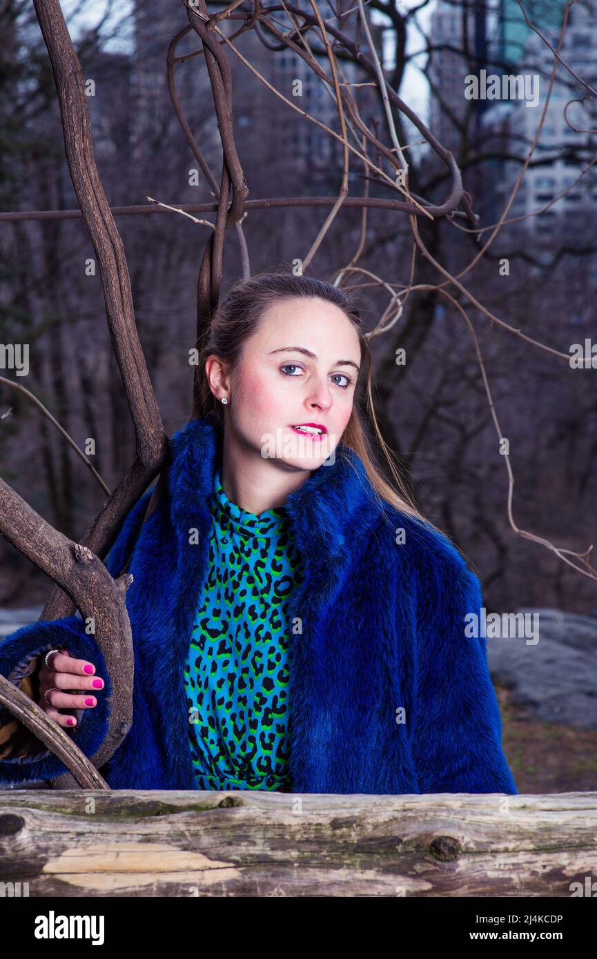 A pretty woman is looking at you in a chilling winter Stock Photo - Alamy