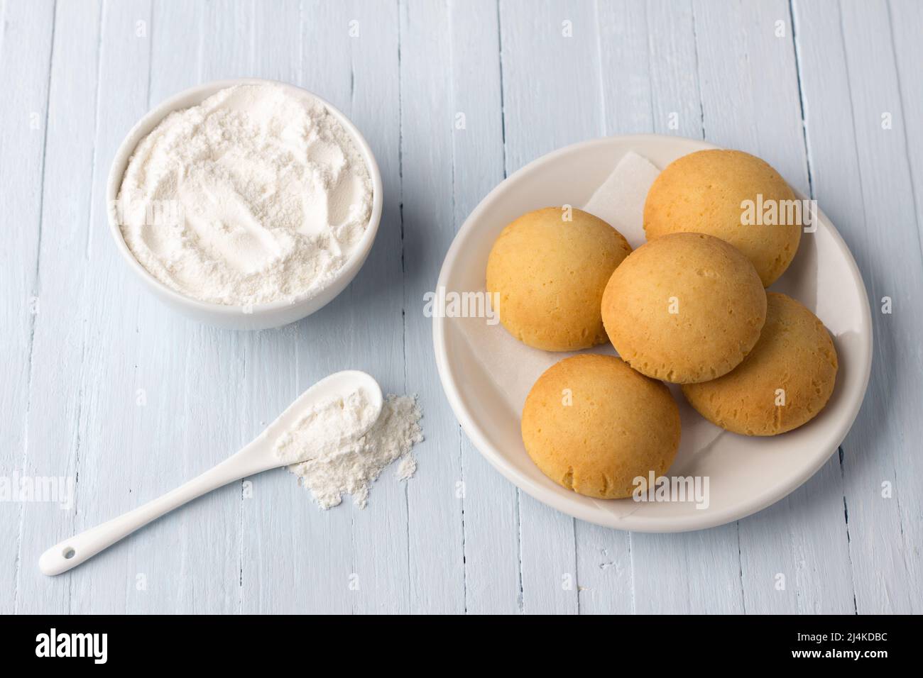 Homemade gluten free cottage cheese rice cookies and bowl rice flour on light background